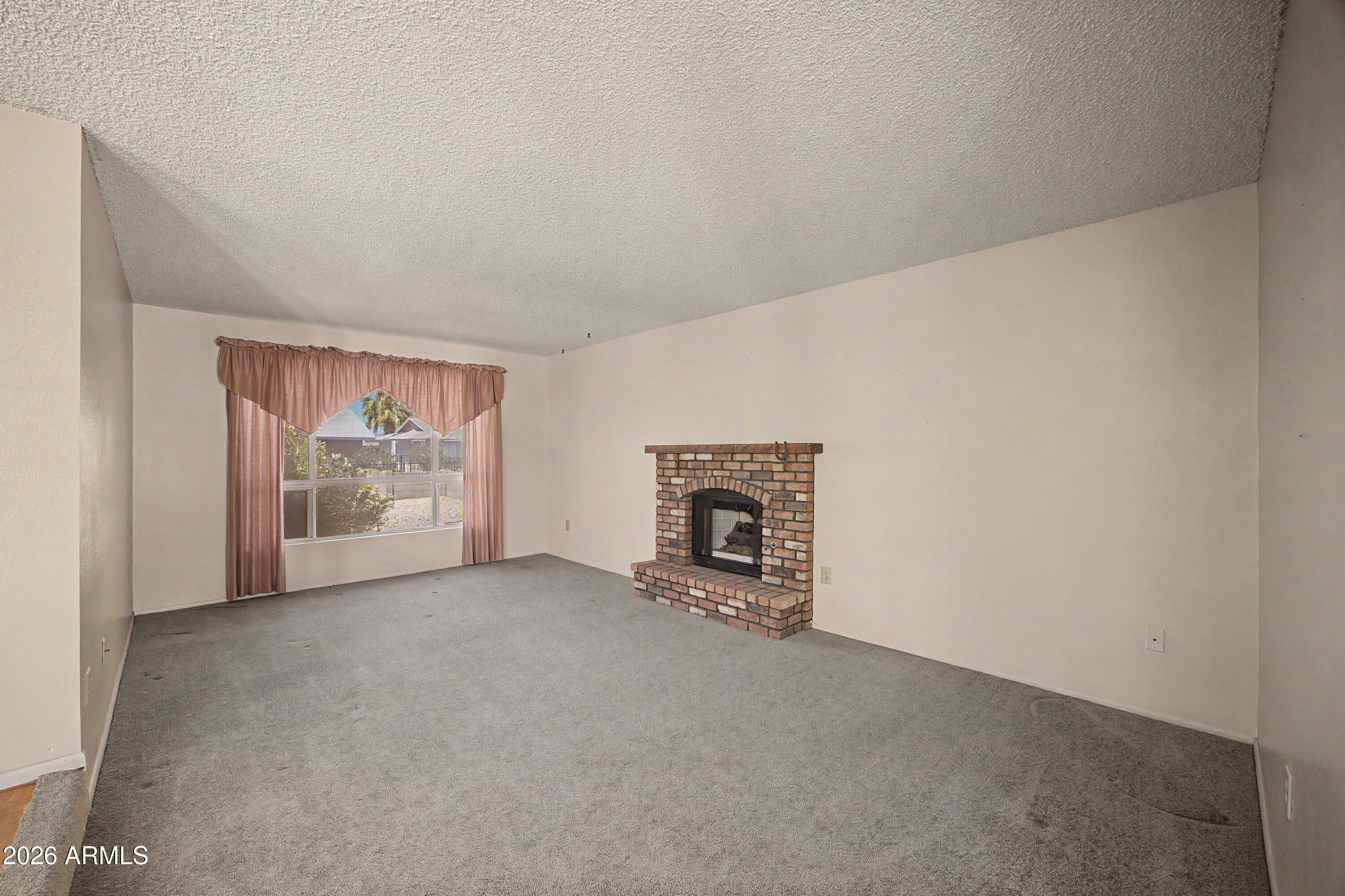 10415 West Ridgeview Road Sun City, AZ 85351 - Photo 10 of 30 Family Room w/ Fireplace