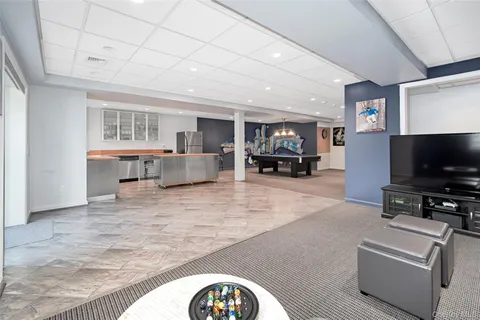 a view of living room with furniture and a flat screen tv