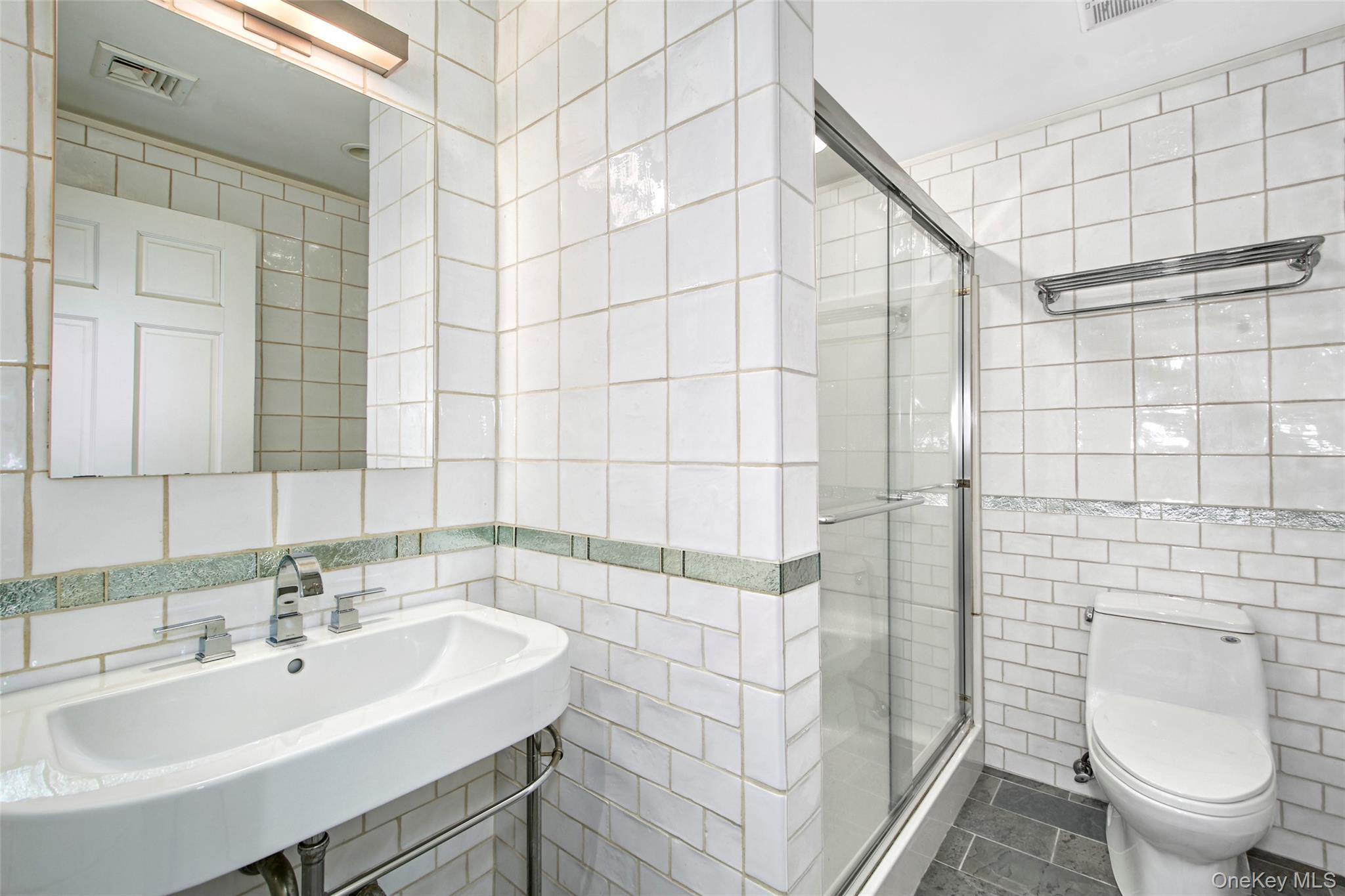 17 Byram Meadows Road Armonk, NY 10504 - Photo 39 of 49 a bathroom with a sink a toilet and shower