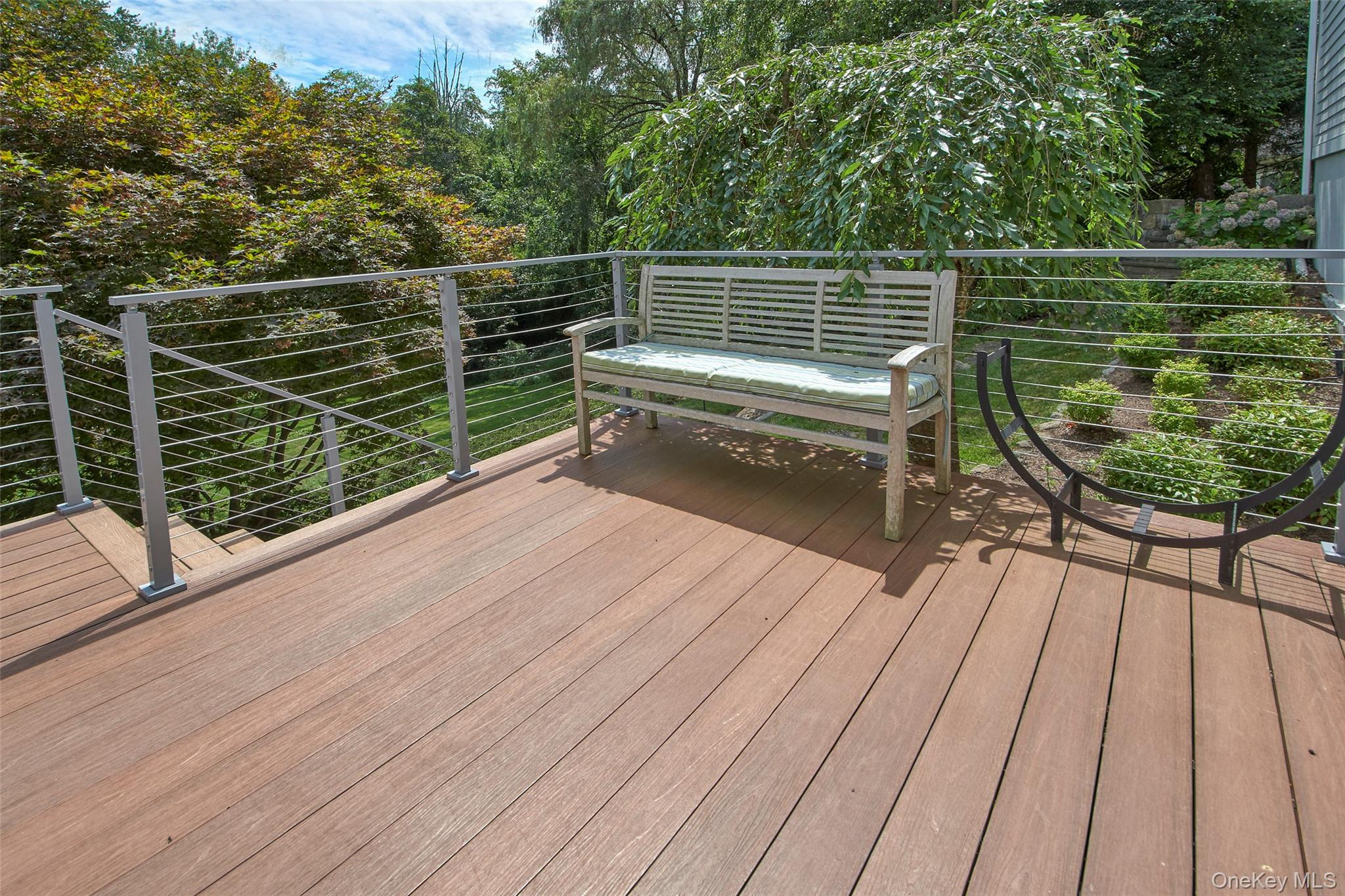 17 Byram Meadows Road Armonk, NY 10504 - Photo 44 of 49 a view of a roof deck with wooden floor and fence