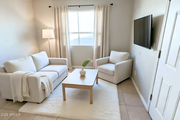 a living room with furniture and a flat screen tv