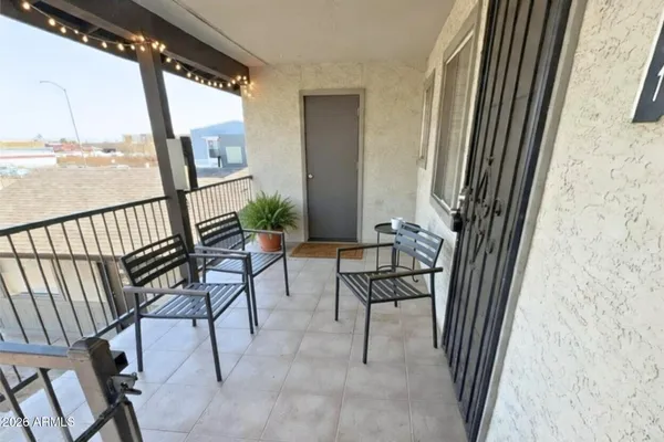 a view of balcony with furniture