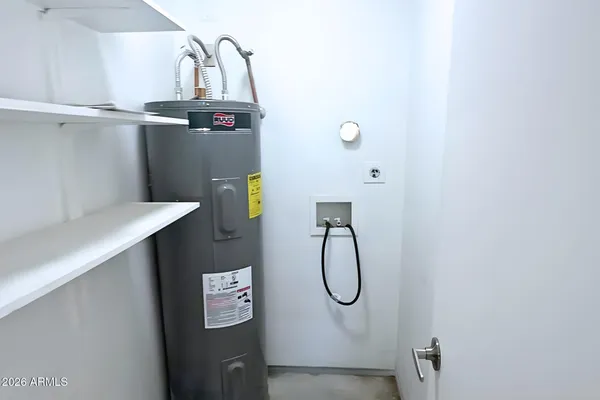 a bathroom with a granite countertop shower a mirror and a sink