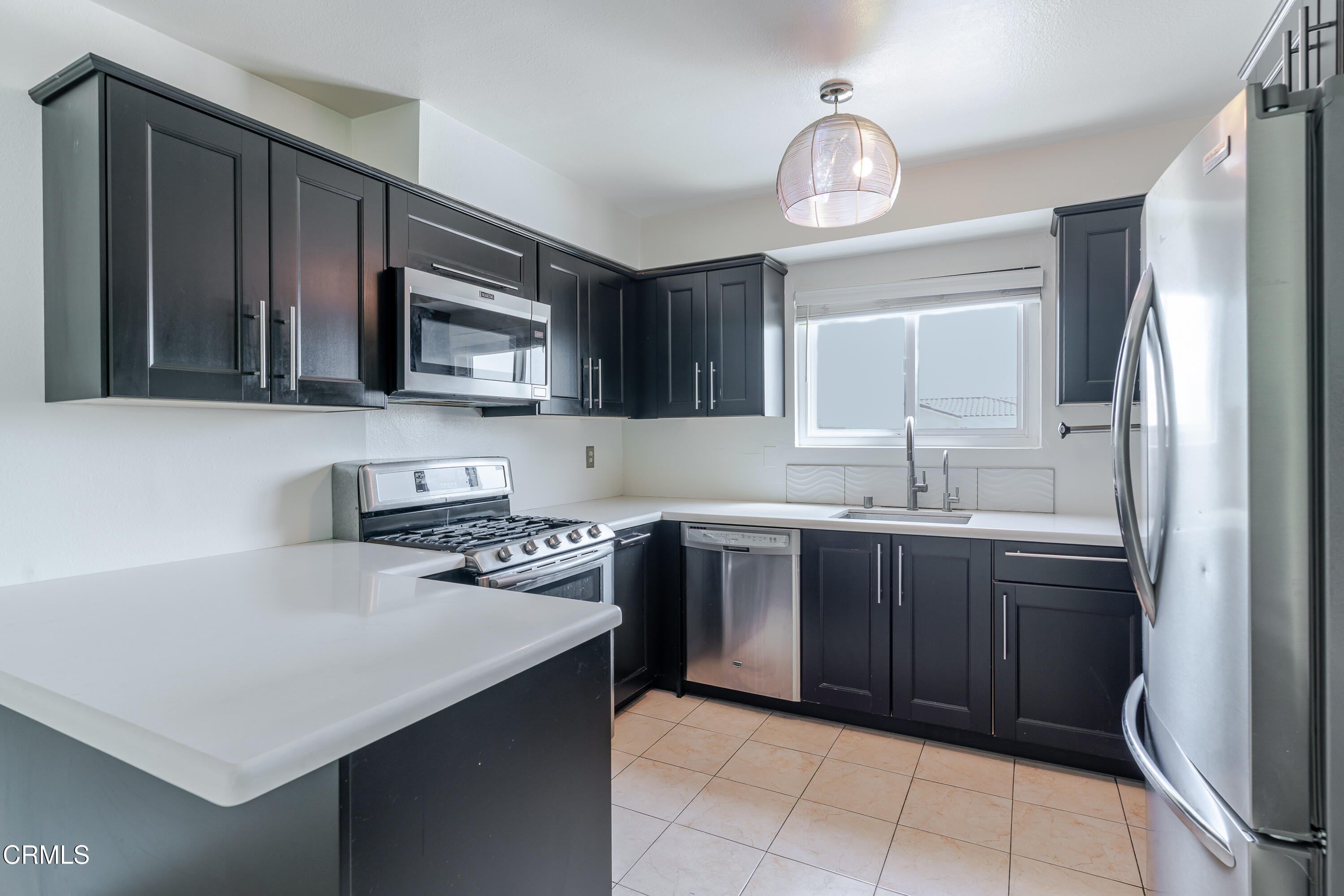 500 Jackson Place, Unit 313 Glendale, CA 91206 - Photo 5 of 19 a kitchen with stainless steel appliances a stove a sink a refrigerator and a oven