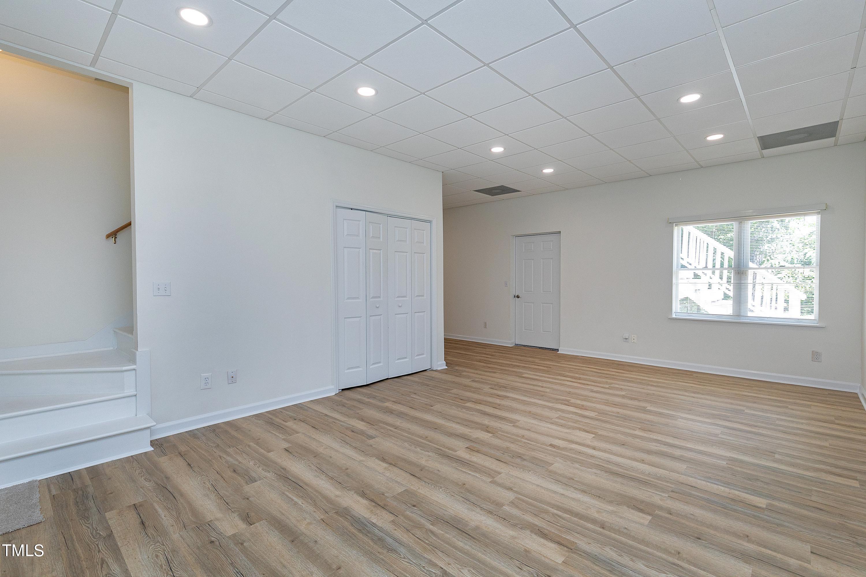3900 Old Coach Road Raleigh, NC 27616 - Photo 18 of 23 New luxury vinyl planking welcomes to the family room with fresh paint.