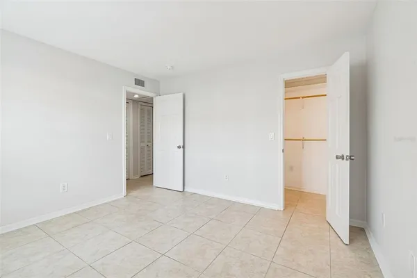 a bathroom with a granite countertop sink toilet tub and shower