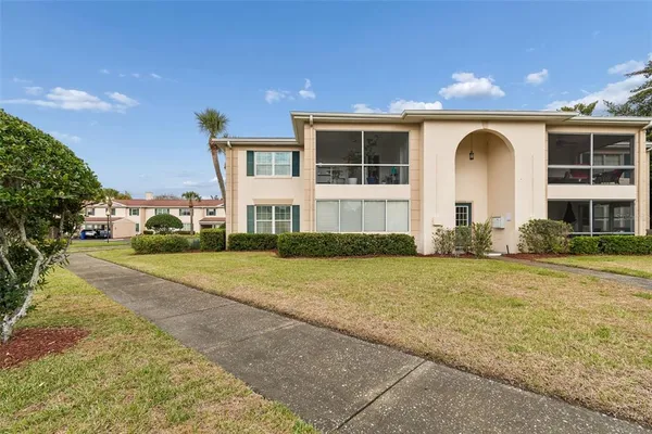 an aerial view of a house with yard swimming pool and outdoor seating