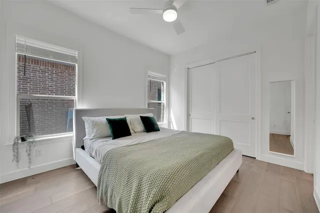 a bedroom with a bed and pillows