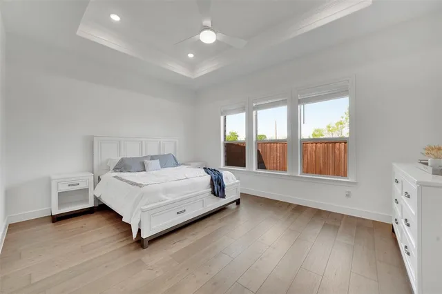 a bed room with a bed and a dresser