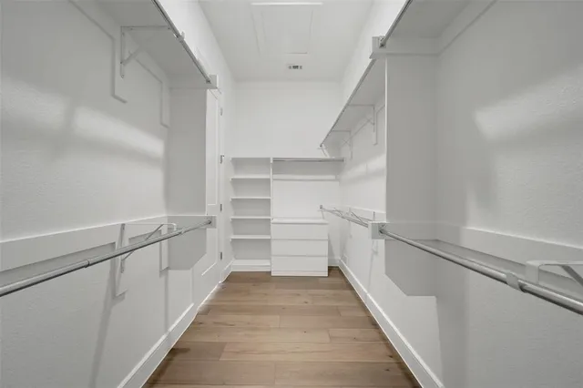 a bathroom with a shower sink and mirror