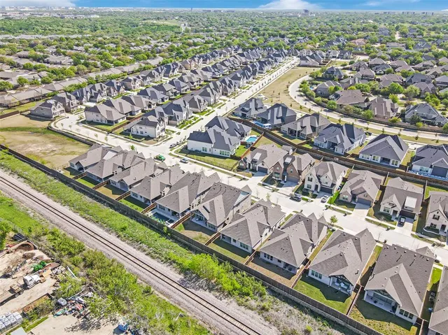 an aerial view of a city with a mountain