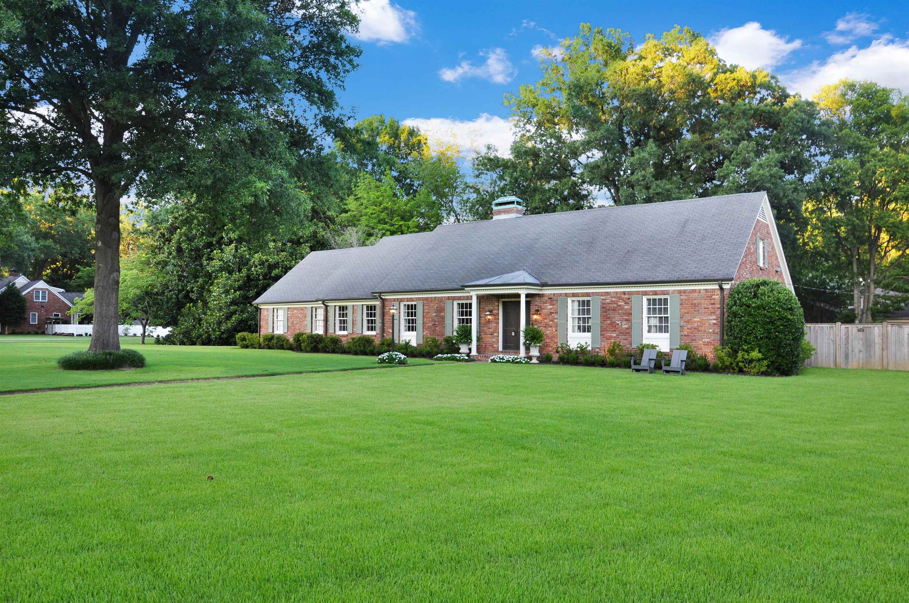 1226 Fair Meadow Road Memphis, TN 38117 - Photo 1 of 40 Discover a storybook haven in East Memphis, where modern elegance meets timeless charm. This beautifully updated home, set on a sprawling 1.06-acre lot, welcomes you with a gated driveway and gleaming hardwood floors.