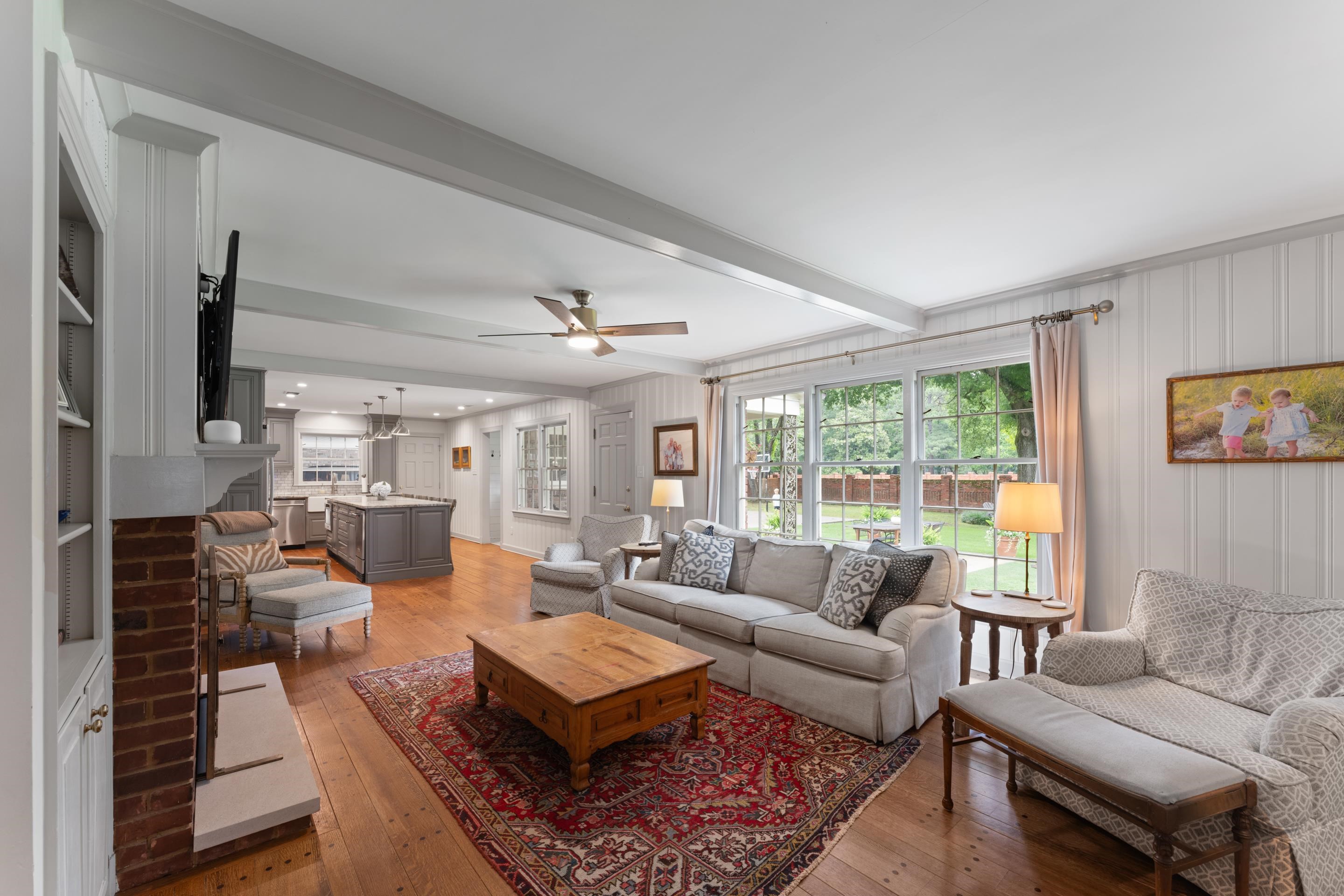 1226 Fair Meadow Road Memphis, TN 38117 - Photo 11 of 40 Great room with beamed ceiling, ceiling fan, wood flooring and it opens to the kitchen.