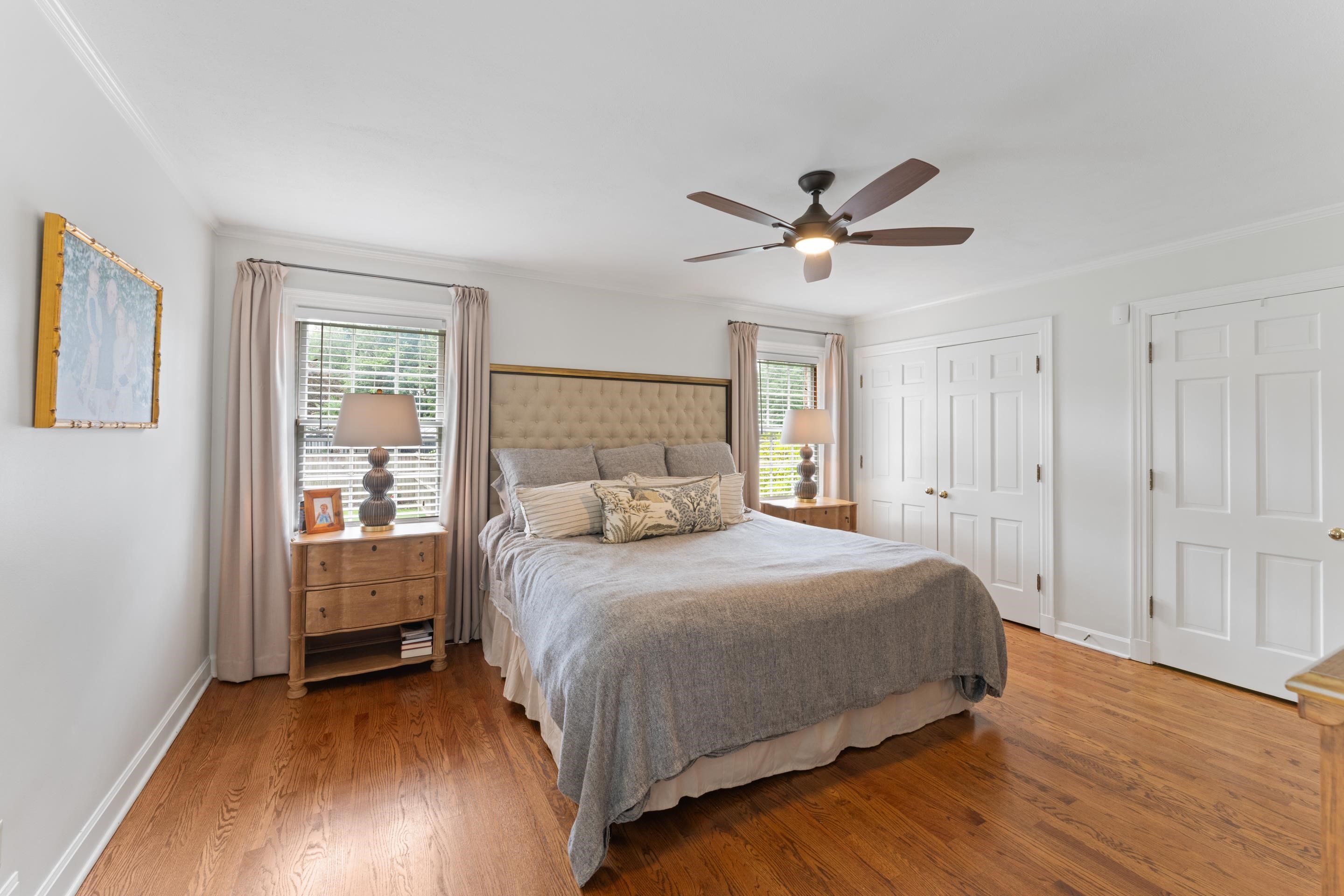 1226 Fair Meadow Road Memphis, TN 38117 - Photo 18 of 40 Primary bedroom with ceiling fan, ornamental molding, closet, hardwood flooring, and private updated bathroom.