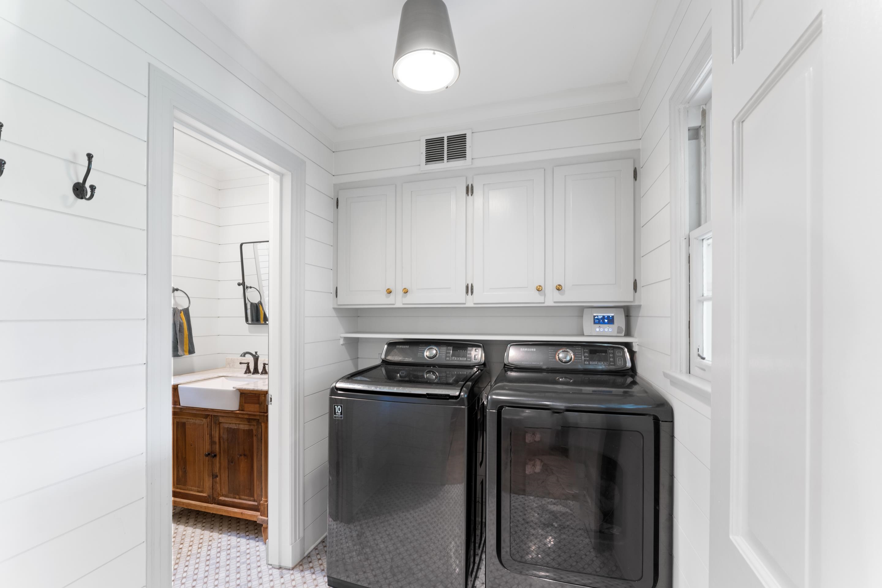 1226 Fair Meadow Road Memphis, TN 38117 - Photo 23 of 40 Laundry room with cabinets and tile flooring.