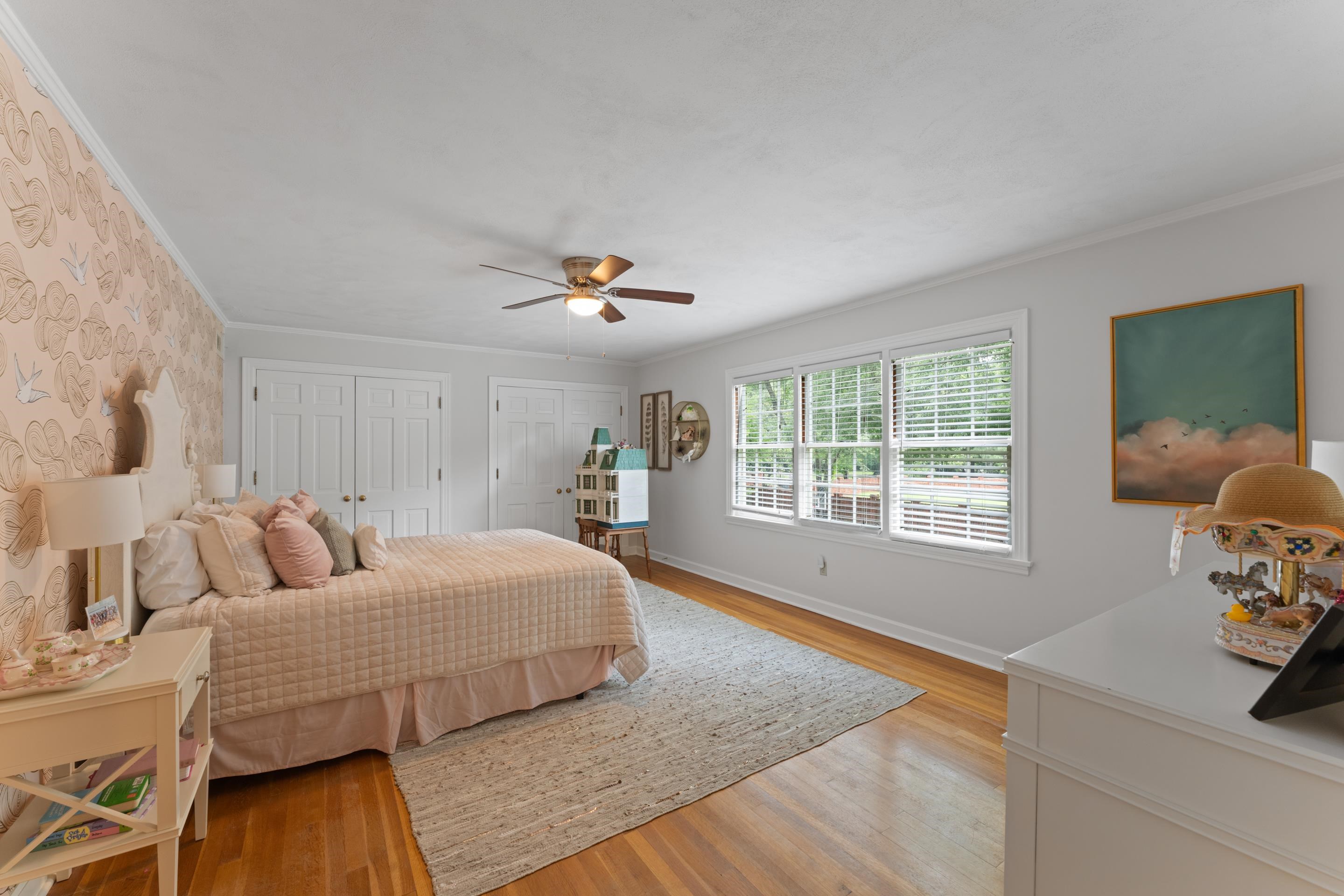 1226 Fair Meadow Road Memphis, TN 38117 - Photo 26 of 40 Bedroom with ornamental molding, 2 closets, ceiling fan, and hardwood flooring.