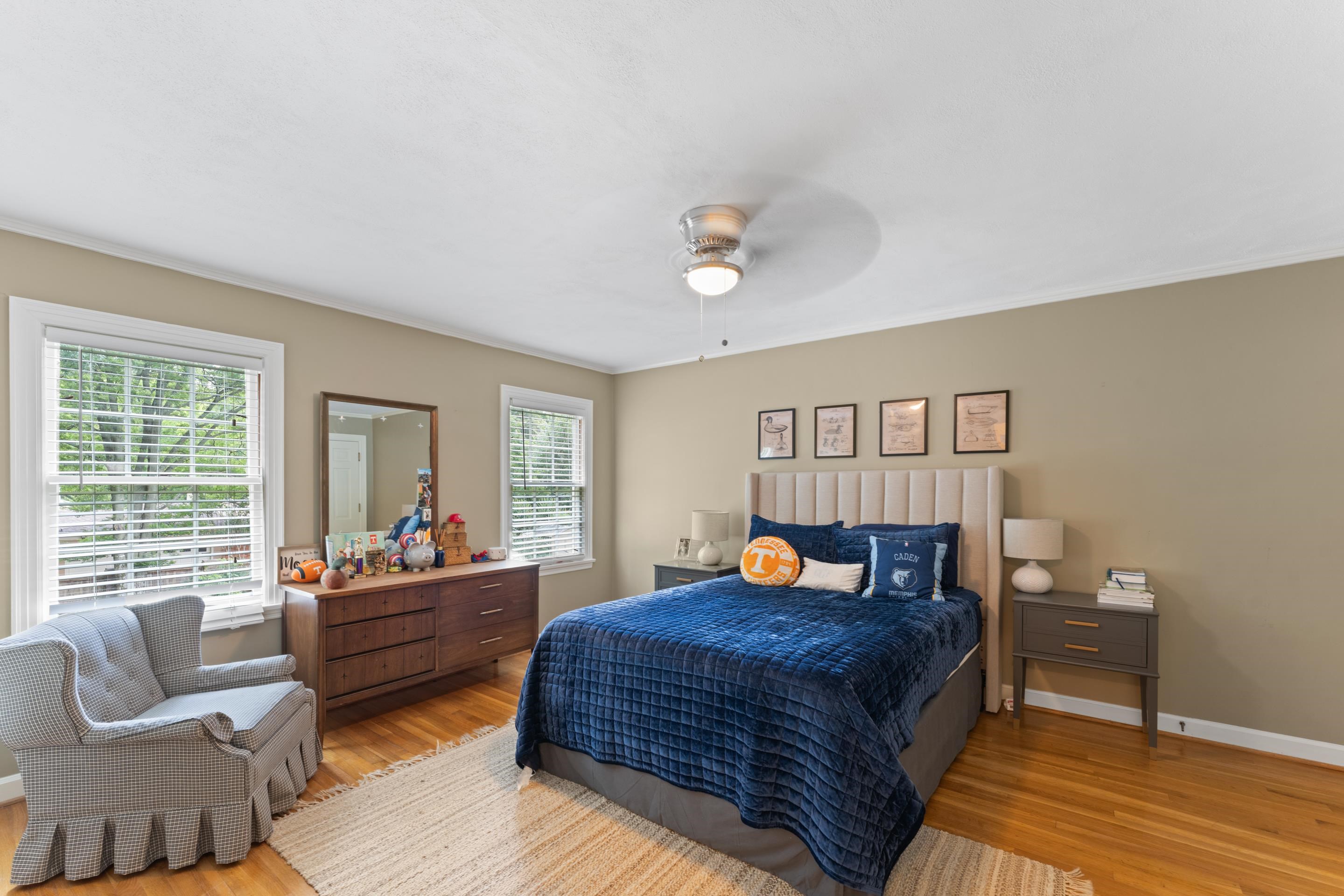 1226 Fair Meadow Road Memphis, TN 38117 - Photo 28 of 40 Bedroom with ceiling fan, closet, and hardwood flooring.