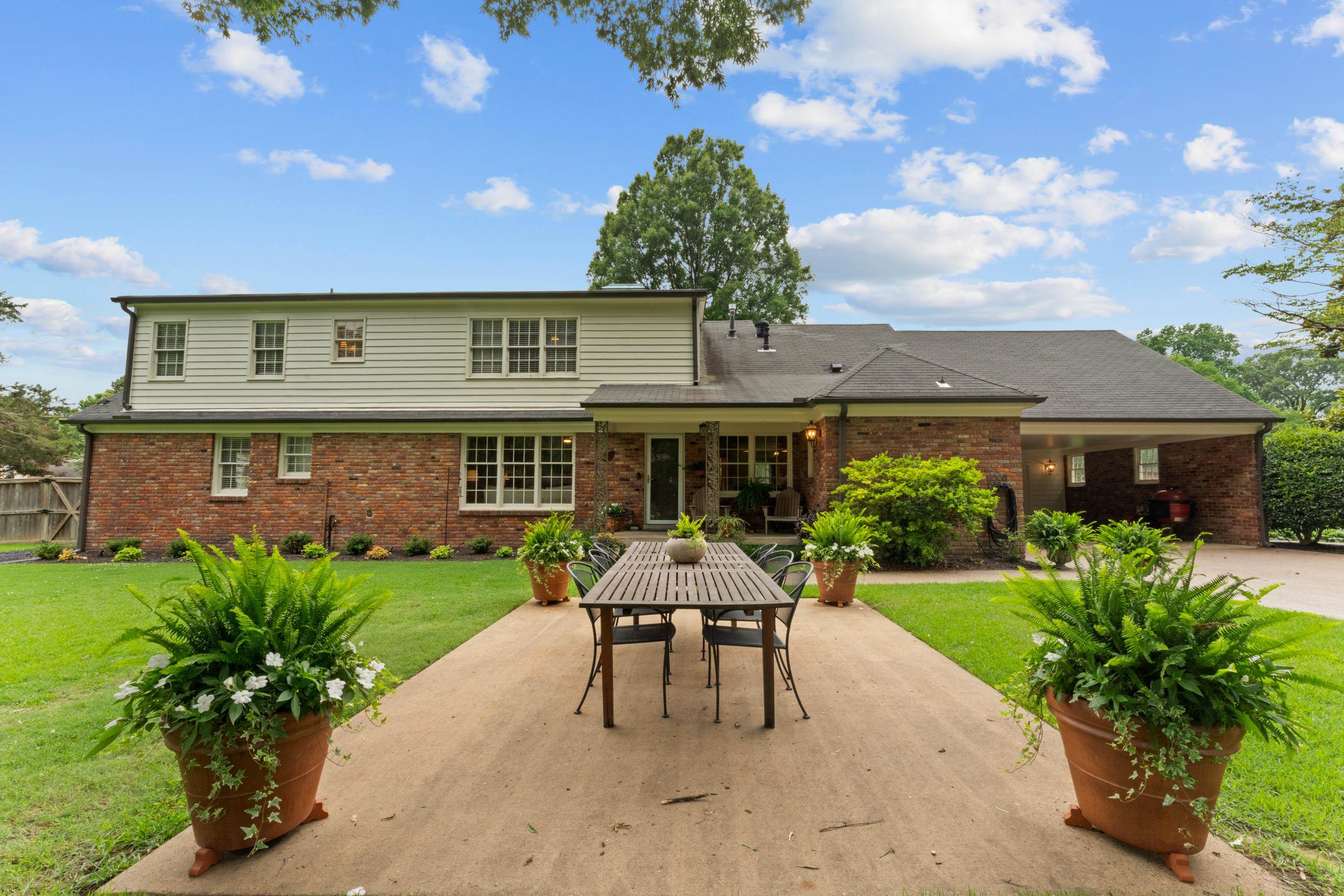 1226 Fair Meadow Road Memphis, TN 38117 - Photo 34 of 40 Back of house featuring a patio area and a lawn.