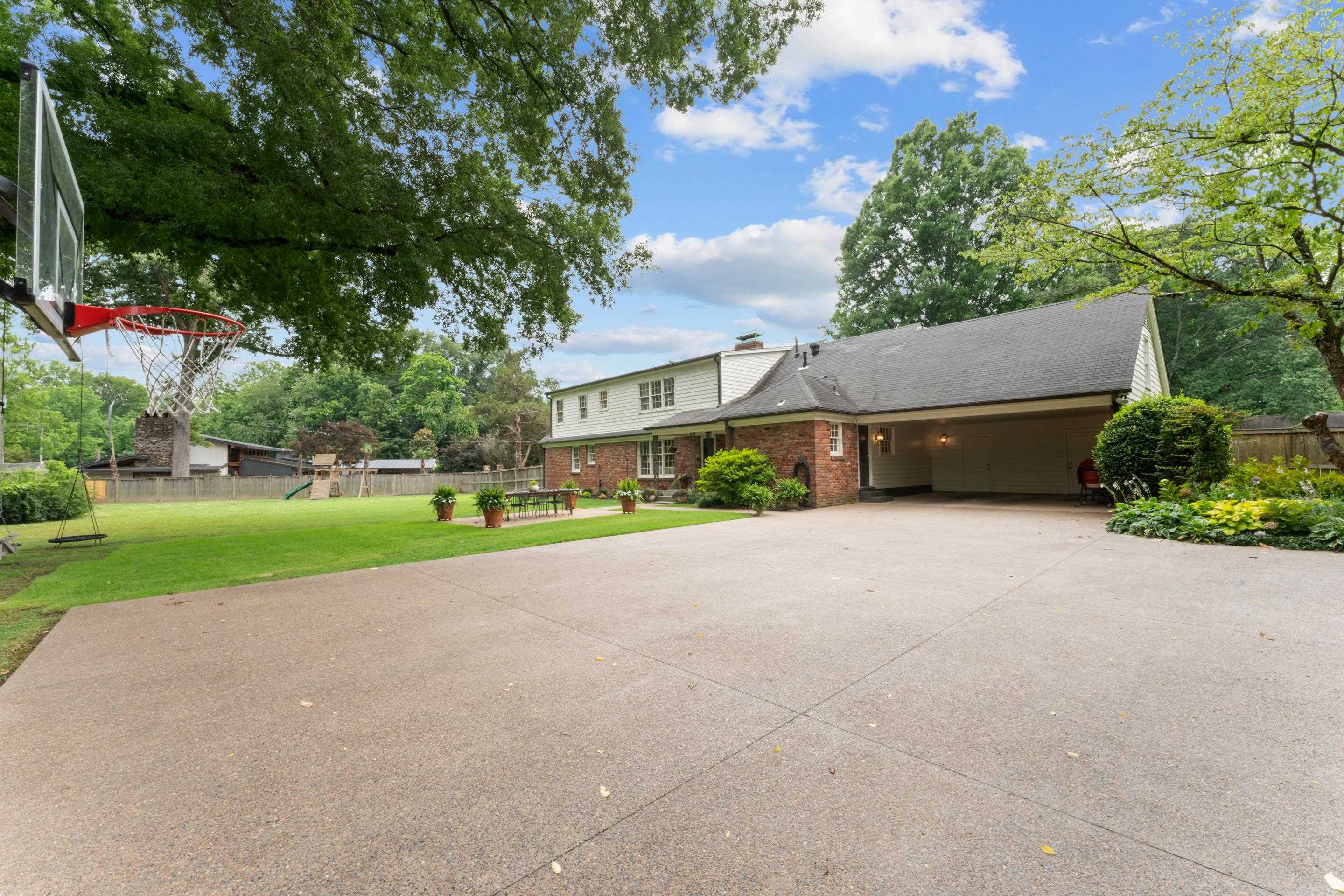 1226 Fair Meadow Road Memphis, TN 38117 - Photo 35 of 40 Notice the large parking pad and 2 car carport.