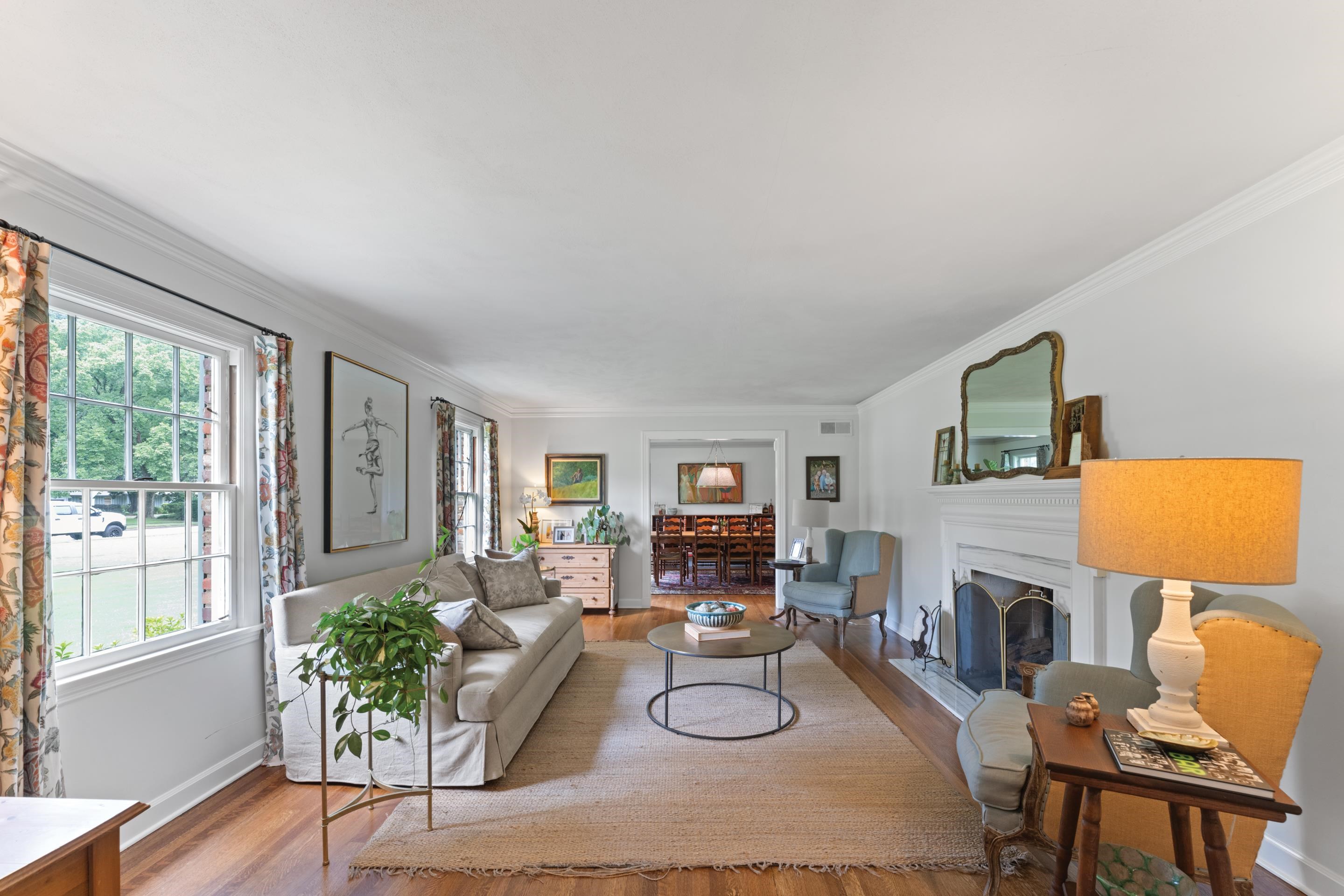 1226 Fair Meadow Road Memphis, TN 38117 - Photo 7 of 40 Living room with crown molding, plenty of natural light, gas fireplace, and wood flooring.