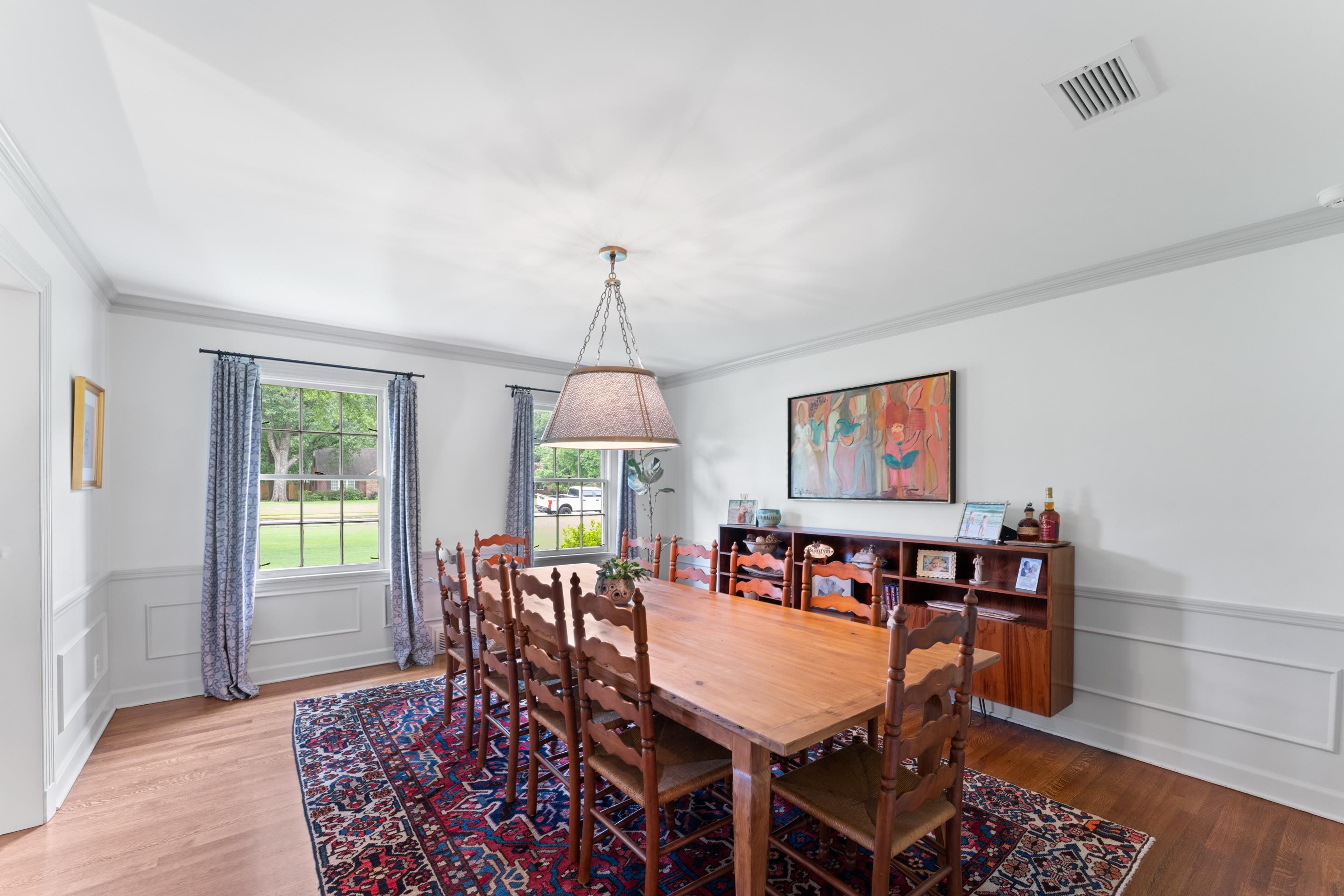 1226 Fair Meadow Road Memphis, TN 38117 - Photo 10 of 40 Dining room with wood flooring and ornamental molding and chair rail.