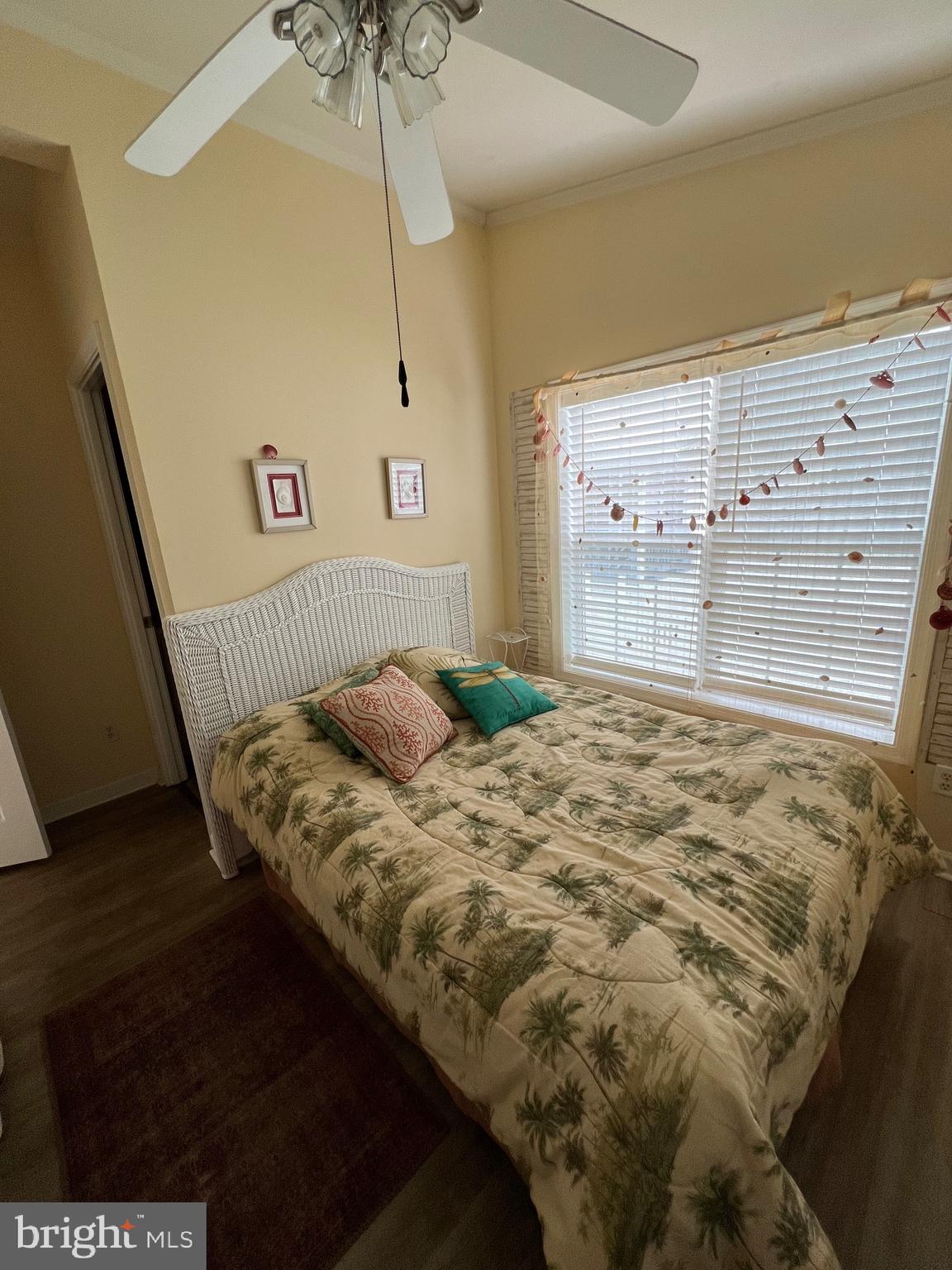 8830 Bay Ridge Drive Berlin, MD 21811 - Photo 17 of 121 a bed sitting in a bedroom next to a window