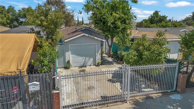 a view of a wrought iron fences in front of house