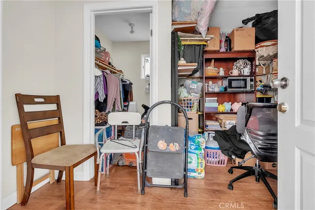 a view of a workspace with furniture and a workspace