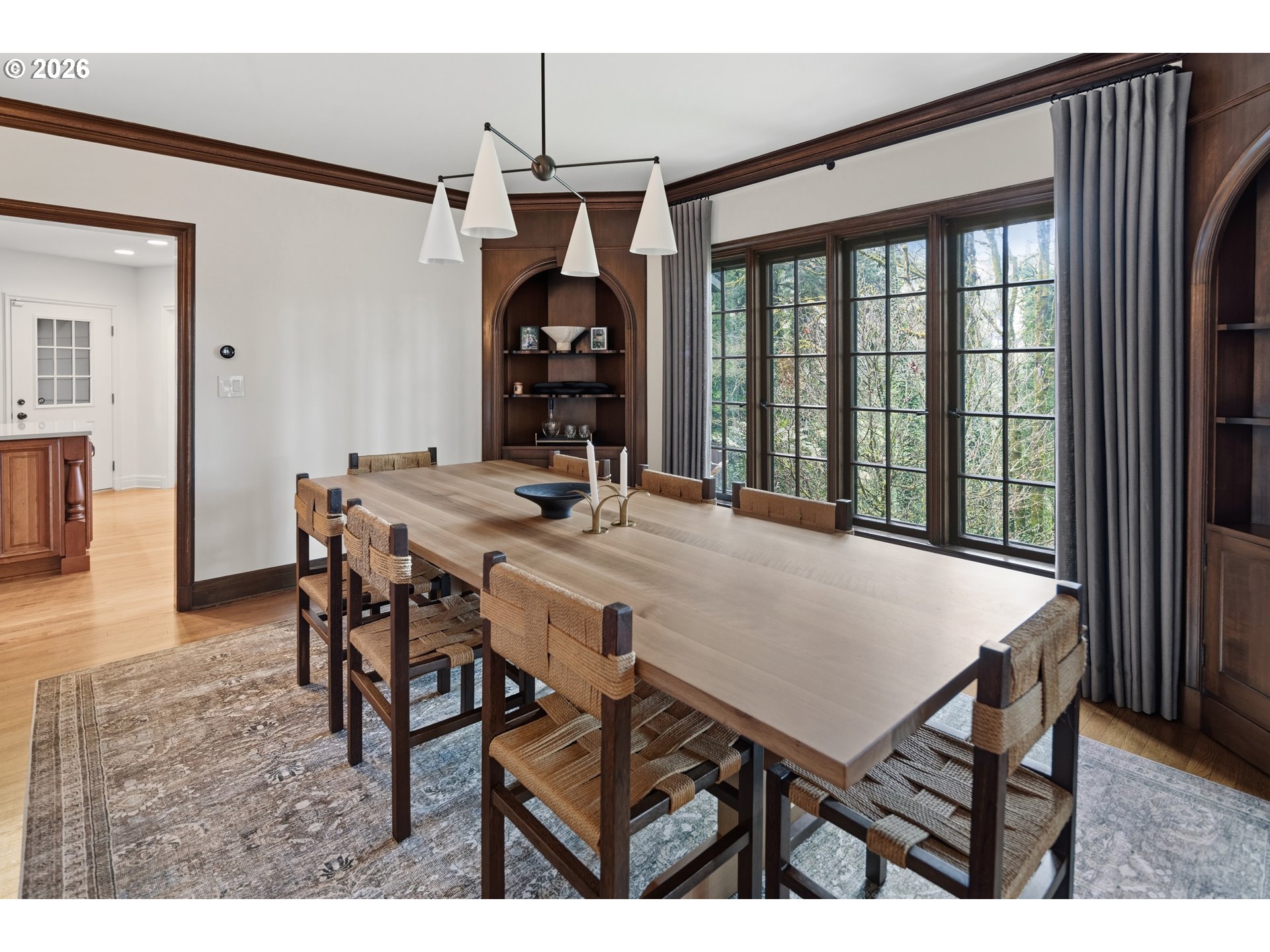 2897 Southwest Rutland Terrace Portland, OR 97205 - Photo 15 of 46 a view of a dining room and livingroom with furniture wooden floor a chandelier