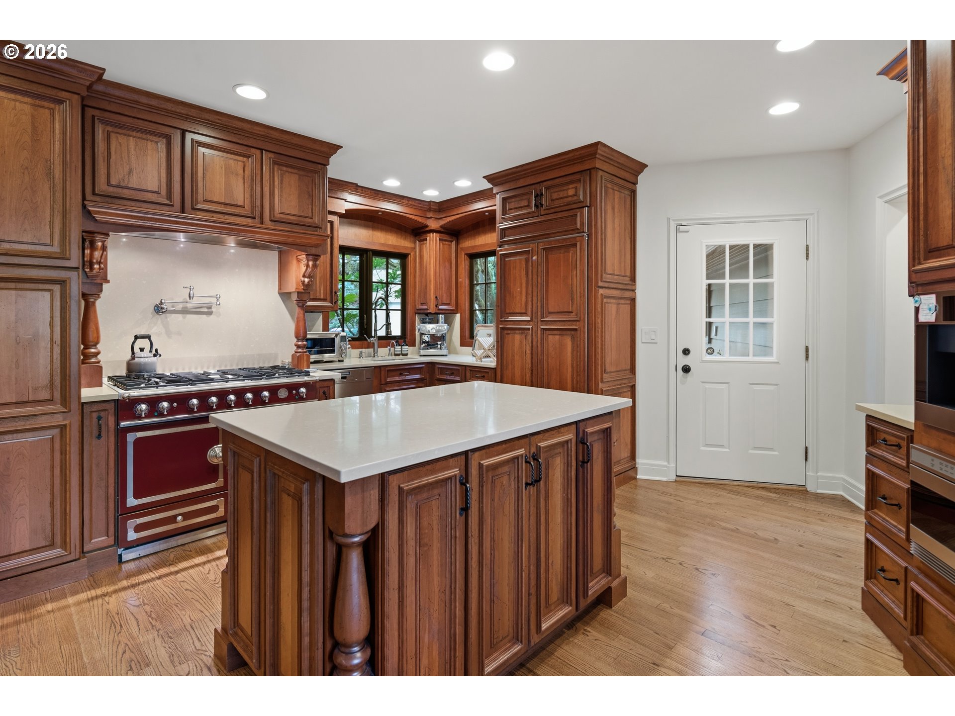 2897 Southwest Rutland Terrace Portland, OR 97205 - Photo 18 of 46 a kitchen that has a sink a stove and a wooden cabinets