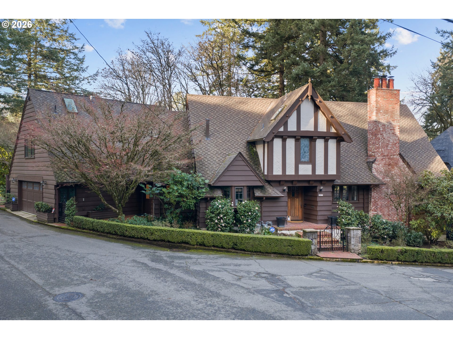 2897 Southwest Rutland Terrace Portland, OR 97205 - Photo 2 of 46 a front view of a house with garden