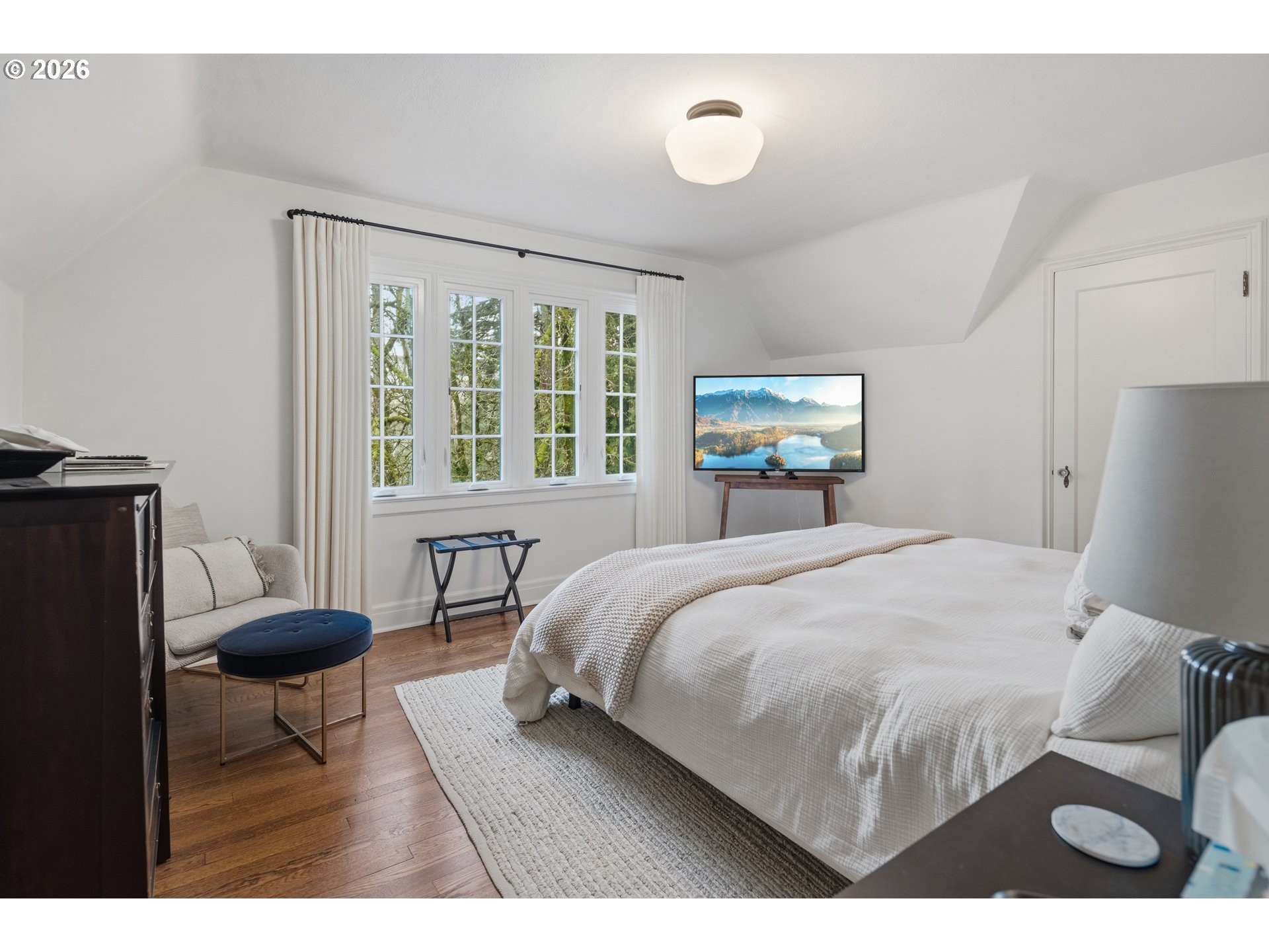 2897 Southwest Rutland Terrace Portland, OR 97205 - Photo 27 of 46 a bedroom with a bed and a large window