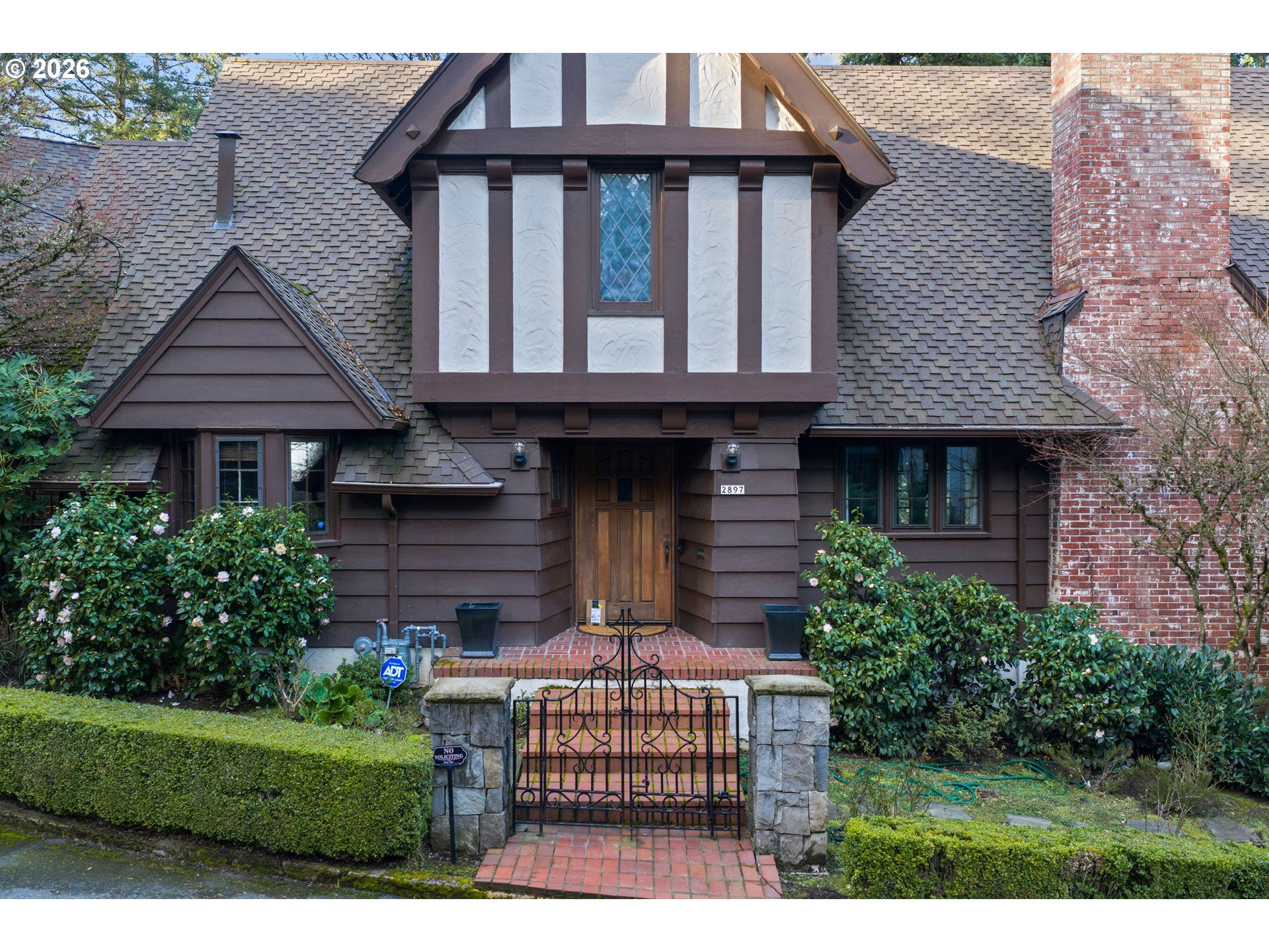 2897 Southwest Rutland Terrace Portland, OR 97205 - Photo 3 of 46 a front view of a house with a garden