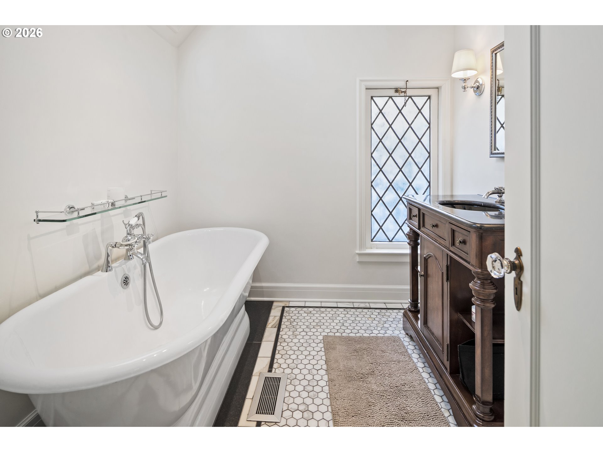 2897 Southwest Rutland Terrace Portland, OR 97205 - Photo 33 of 46 a bathroom with a sink a toilet and shower