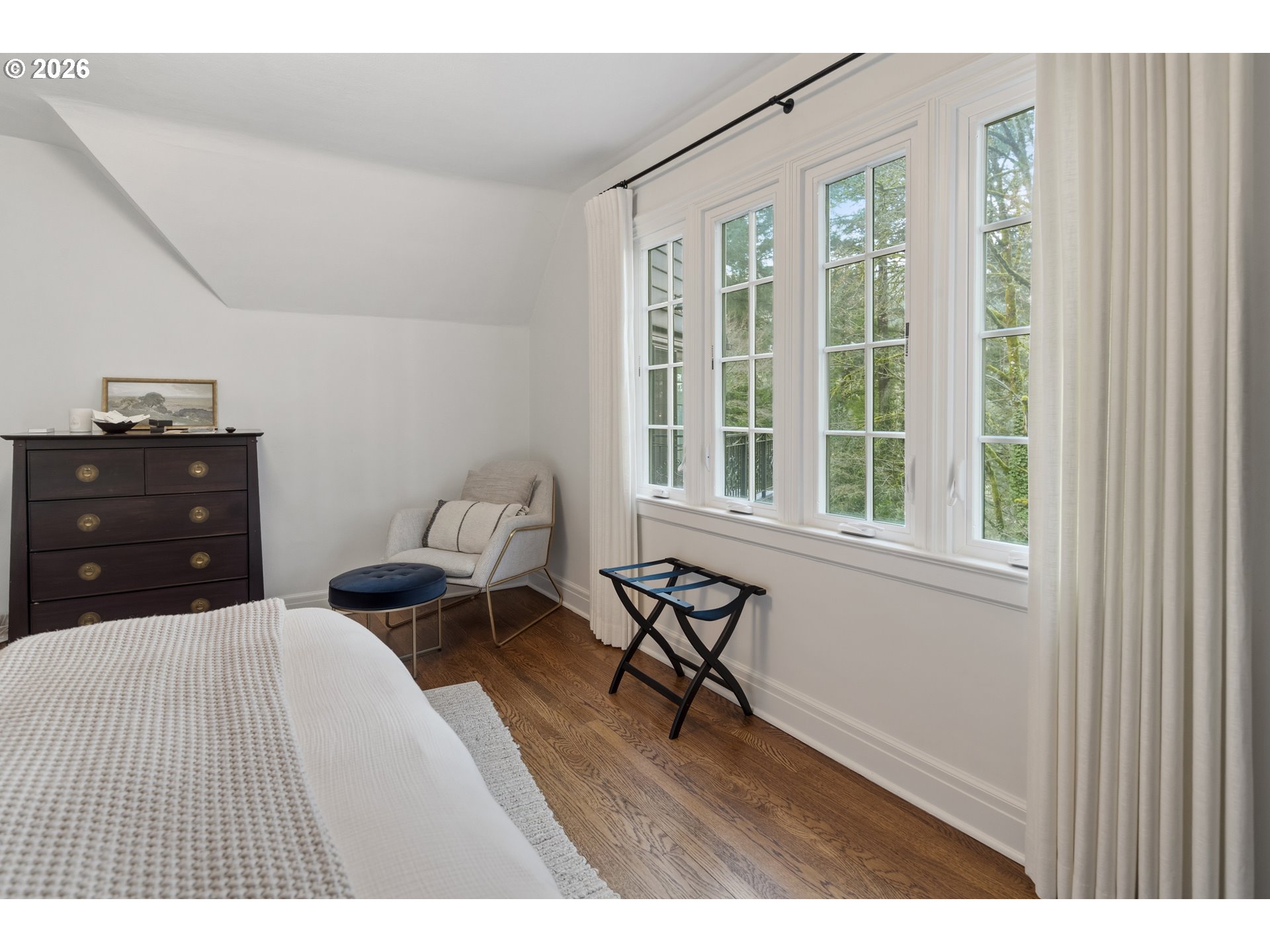 2897 Southwest Rutland Terrace Portland, OR 97205 - Photo 34 of 46 a bedroom with a bed and wooden floor