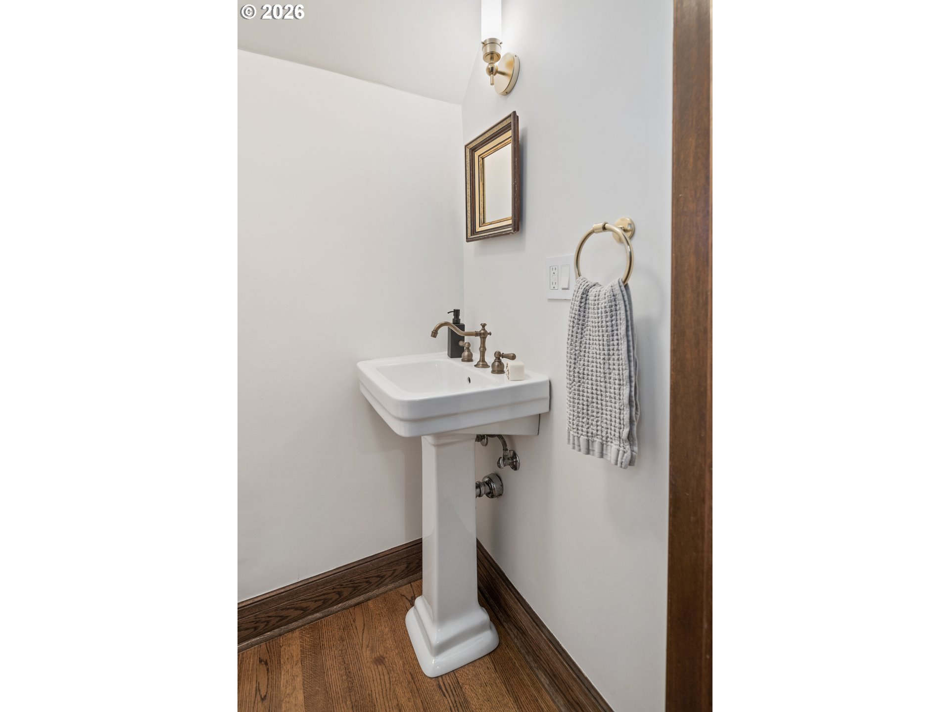 2897 Southwest Rutland Terrace Portland, OR 97205 - Photo 37 of 46 a bathroom with a sink and a mirror