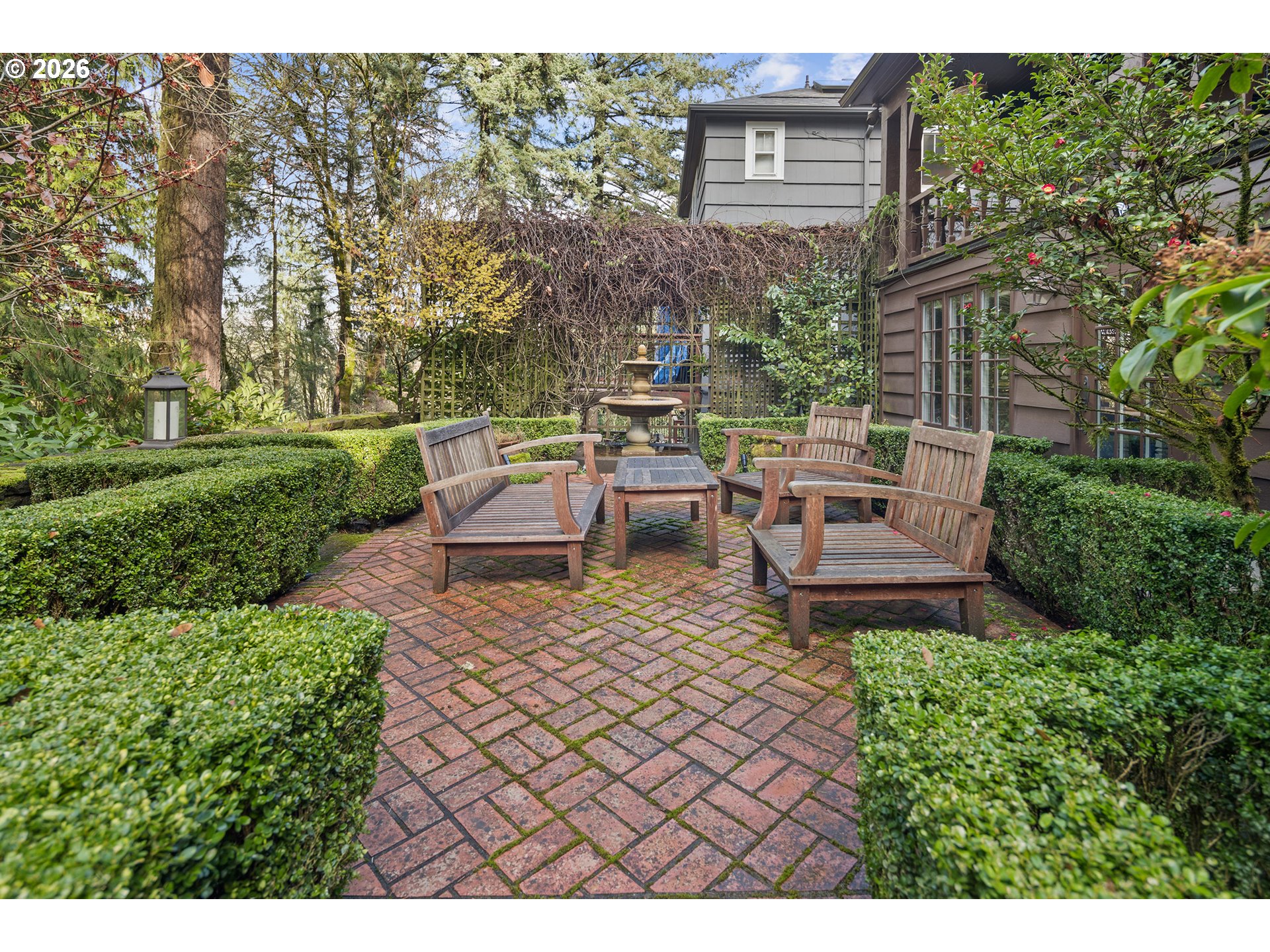 2897 Southwest Rutland Terrace Portland, OR 97205 - Photo 39 of 46 a view of a house with backyard sitting area and garden