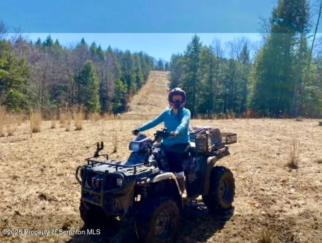 a view of a house with a door and wooden floor