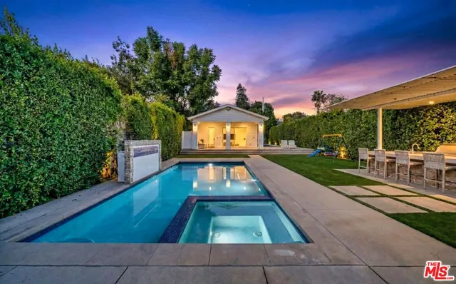 a view of a swimming pool with a patio