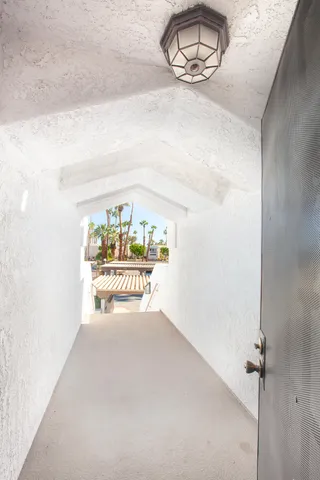 a view of a porch with a sitting area