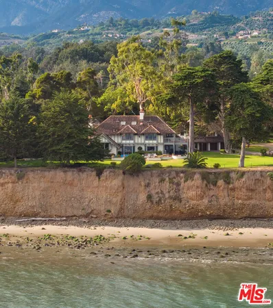 a view of a lake with a table and chairs