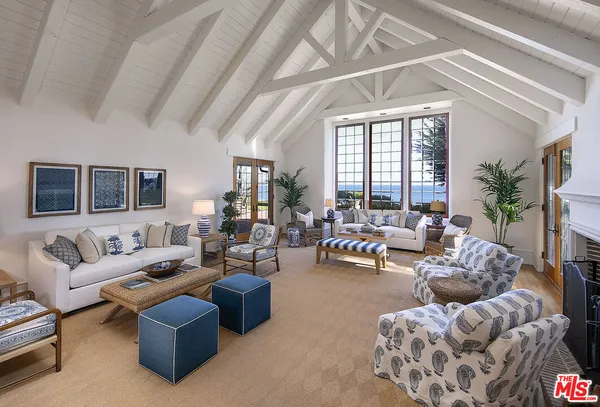 a view of a swimming pool and lounge chairs