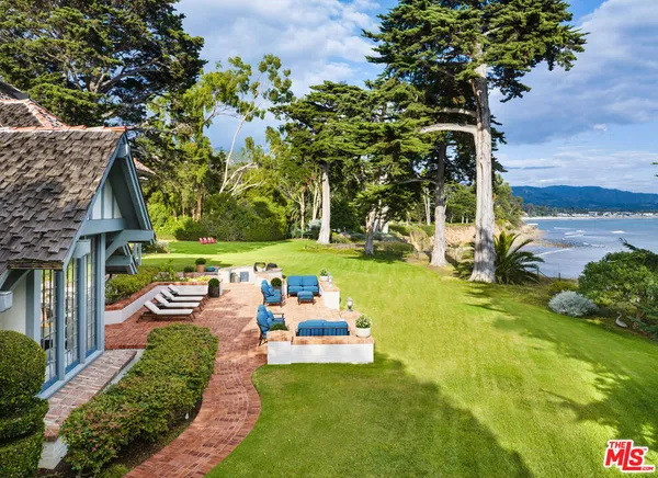a dining room with furniture and a fireplace