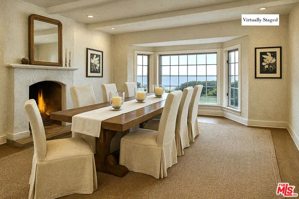 a kitchen with a sink and a fireplace