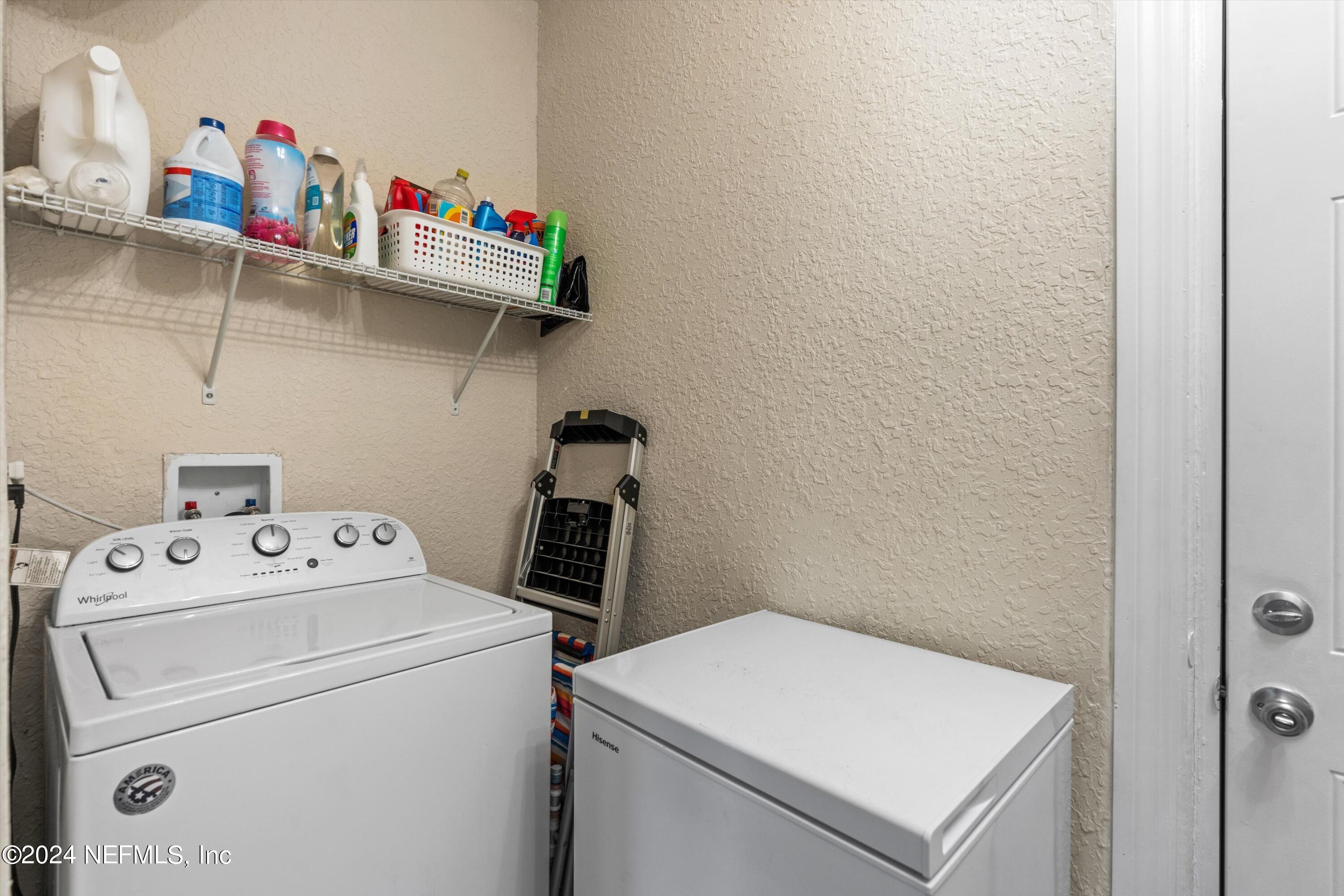 1824 Griflet Road Jacksonville, FL 32211 - Photo 13 of 19 a utility room with dryer and washer