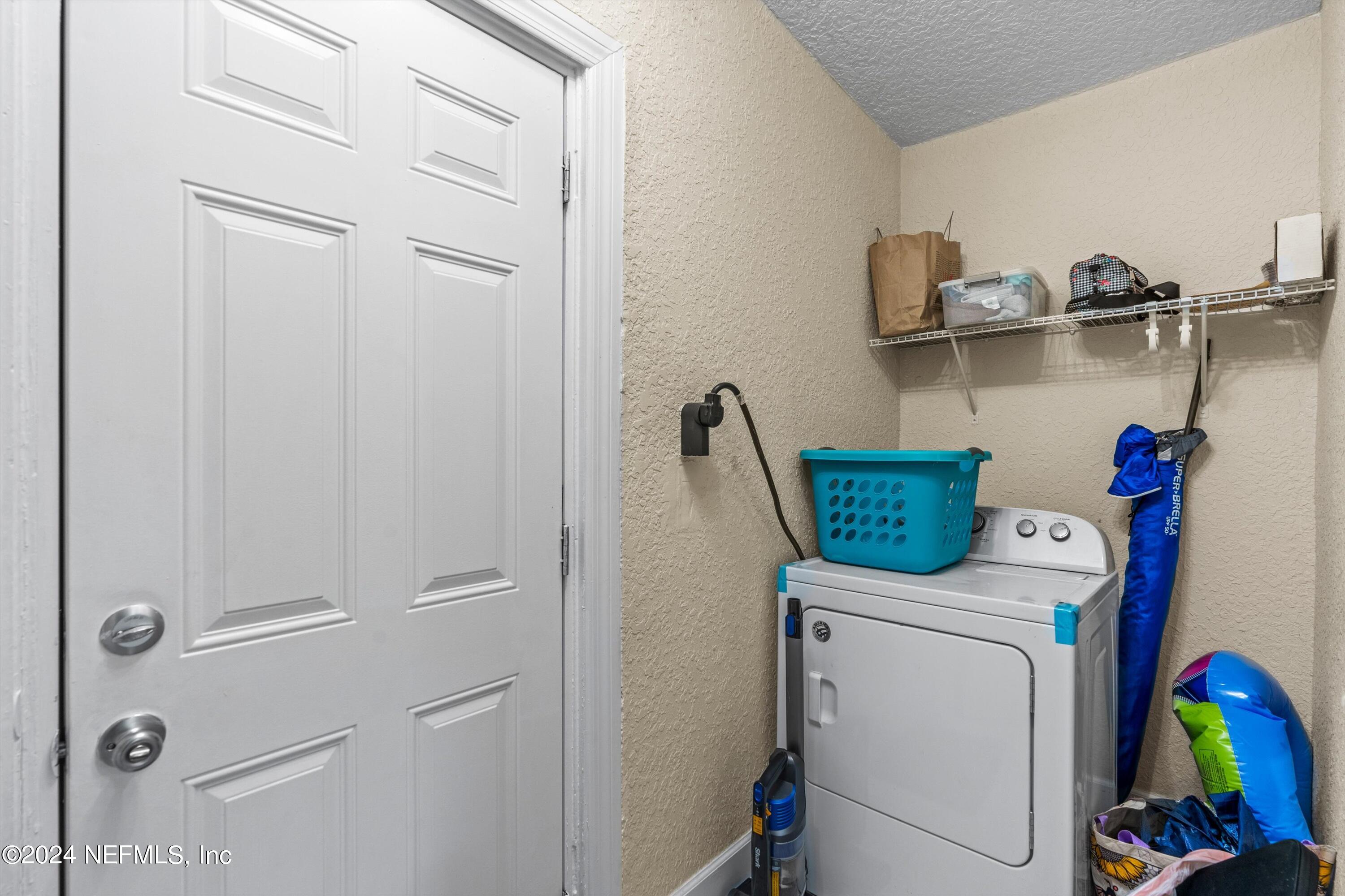 1824 Griflet Road Jacksonville, FL 32211 - Photo 14 of 19 a utility room with dryer and washer