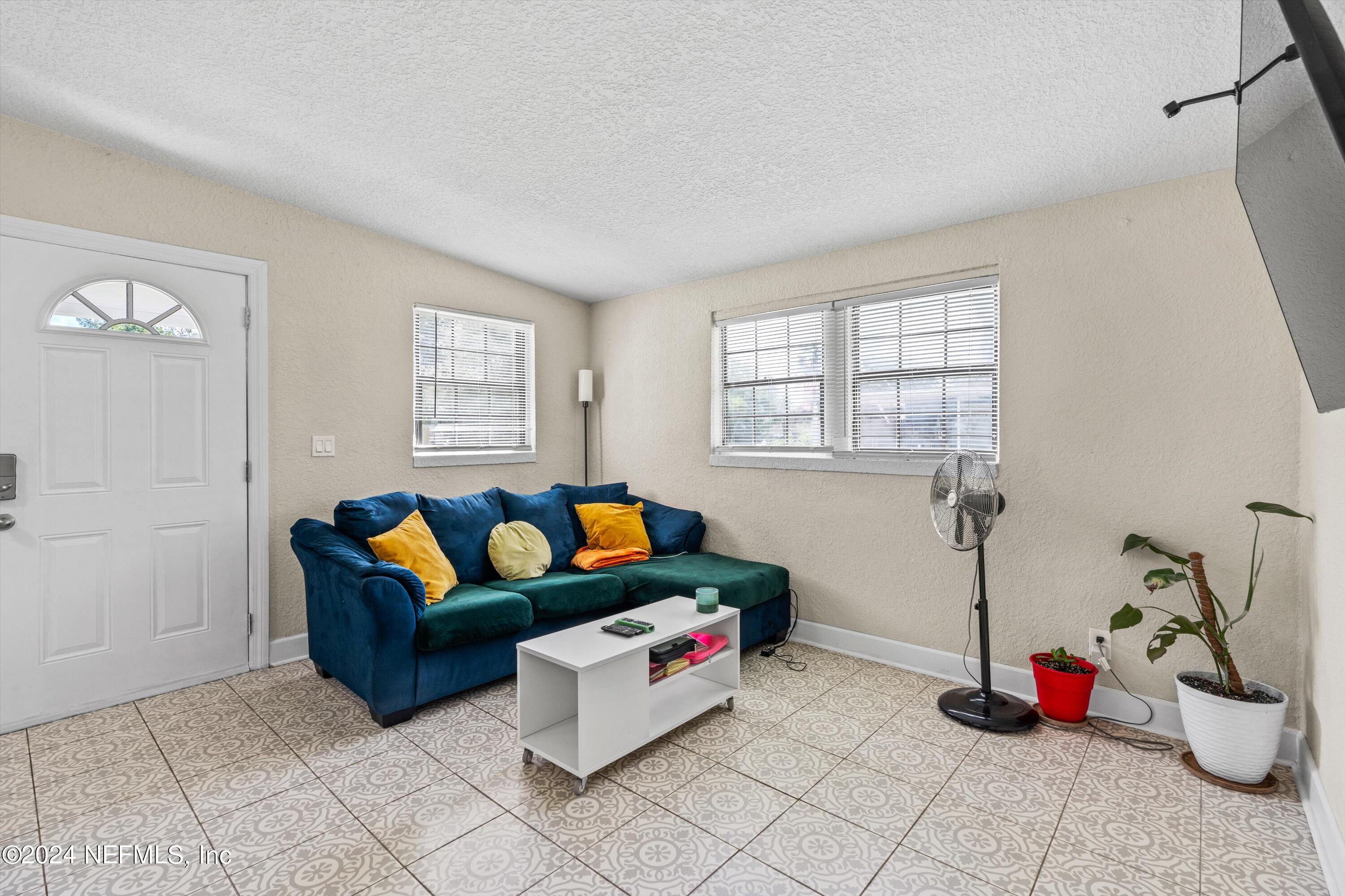 1824 Griflet Road Jacksonville, FL 32211 - Photo 4 of 19 a living room with furniture and a table