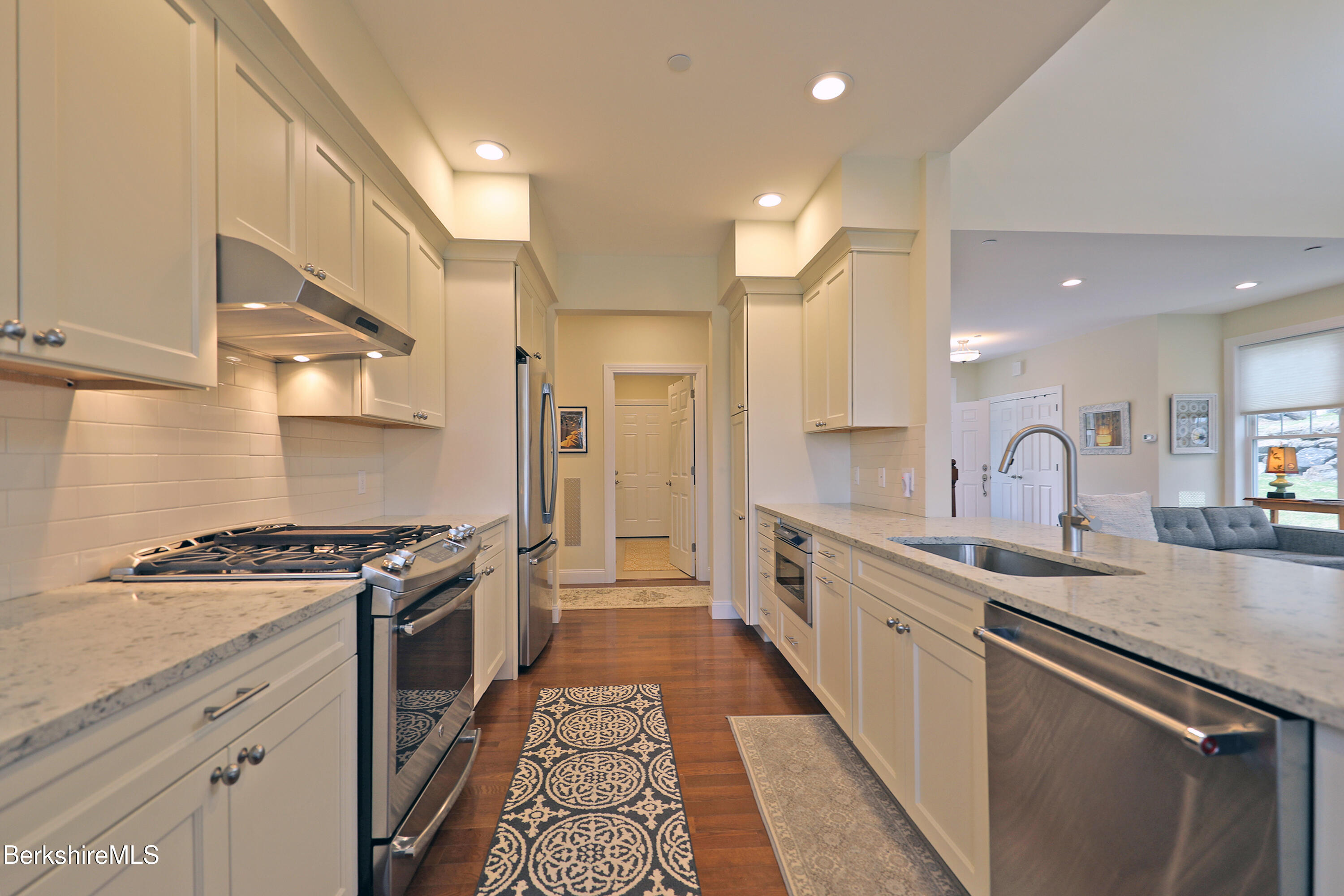 127 Alpine Trail Pittsfield, MA 01201 - Photo 11 of 54 a large kitchen with stainless steel appliances granite countertop a lot of counter space and wooden floors