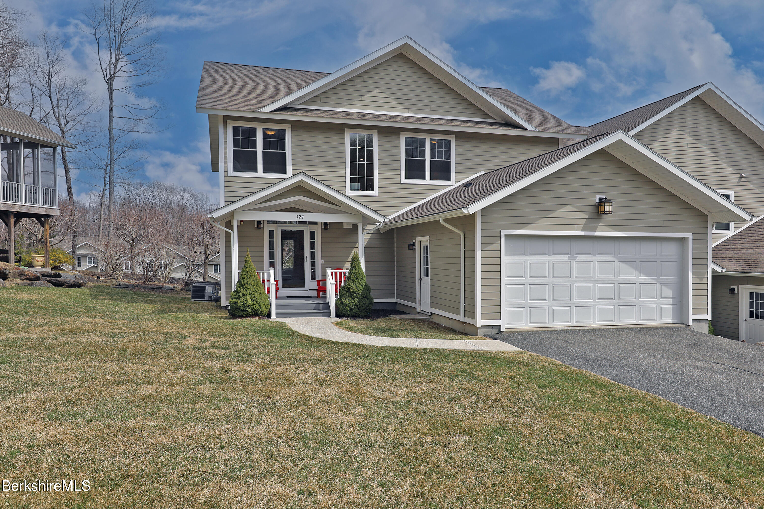 127 Alpine Trail Pittsfield, MA 01201 - Photo 2 of 54 a front view of a house with a yard and garage