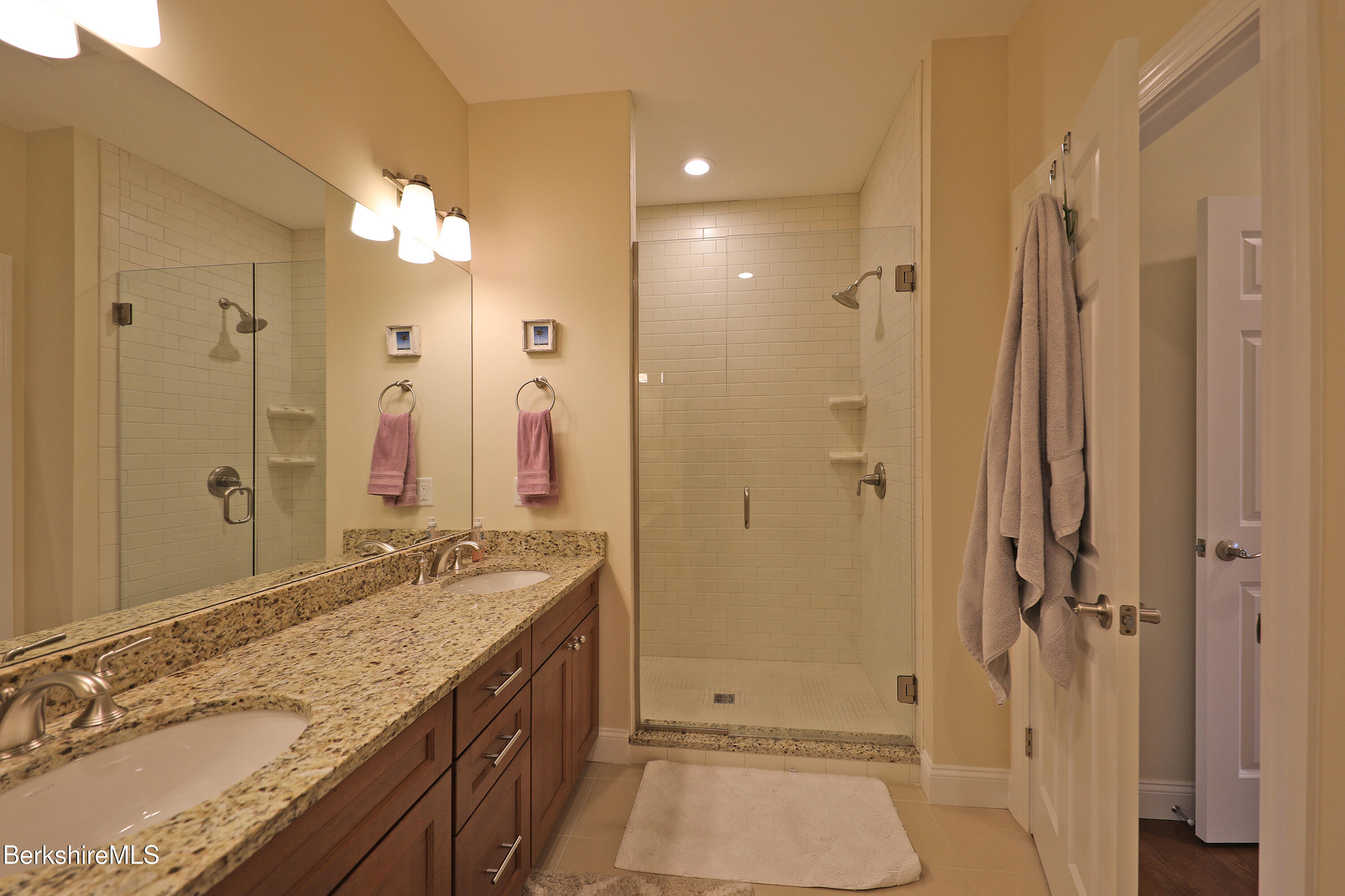 127 Alpine Trail Pittsfield, MA 01201 - Photo 24 of 54 a bathroom with a granite countertop sink mirror and a shower